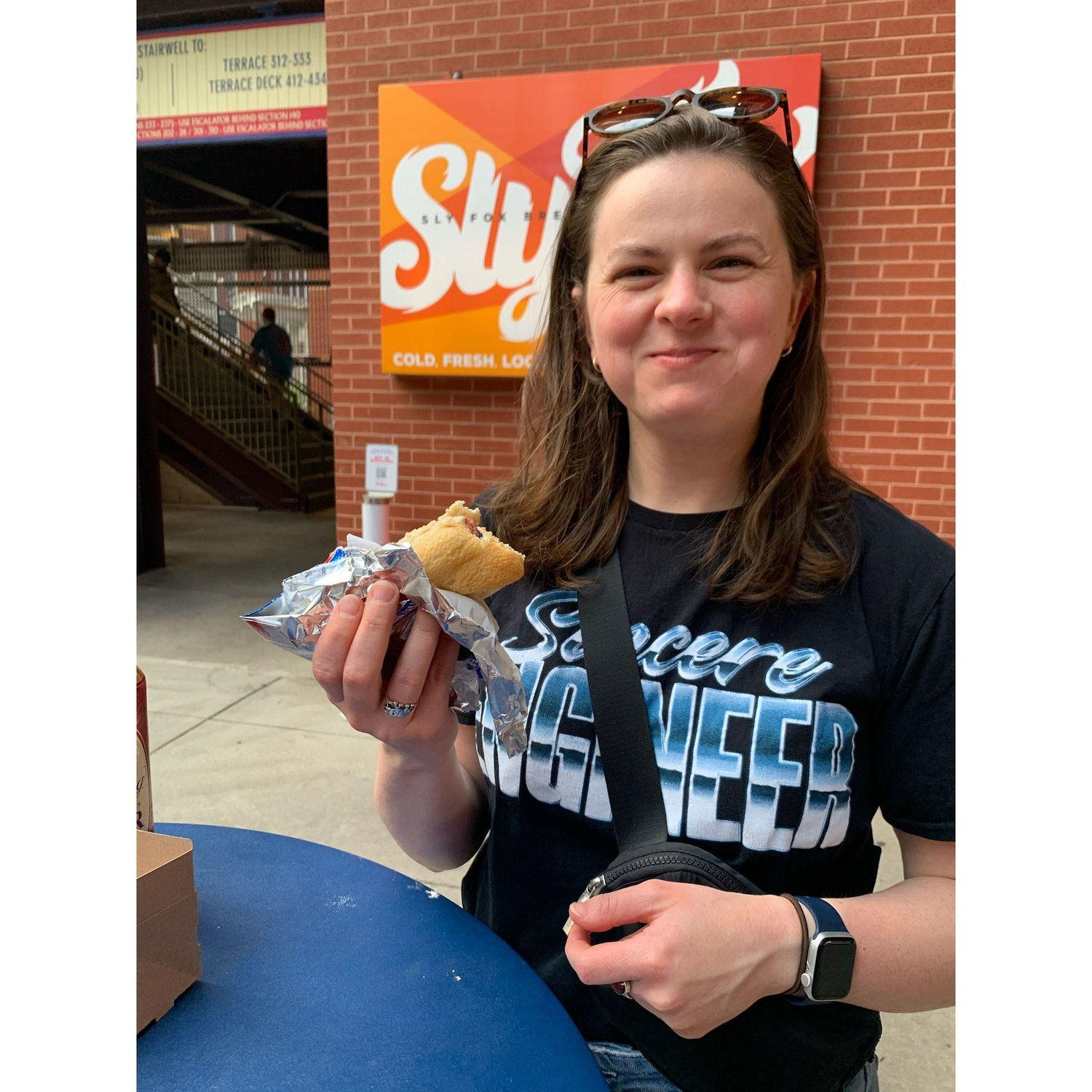 Caroline with a ballpark hotdog at a Phillies game! June 2023