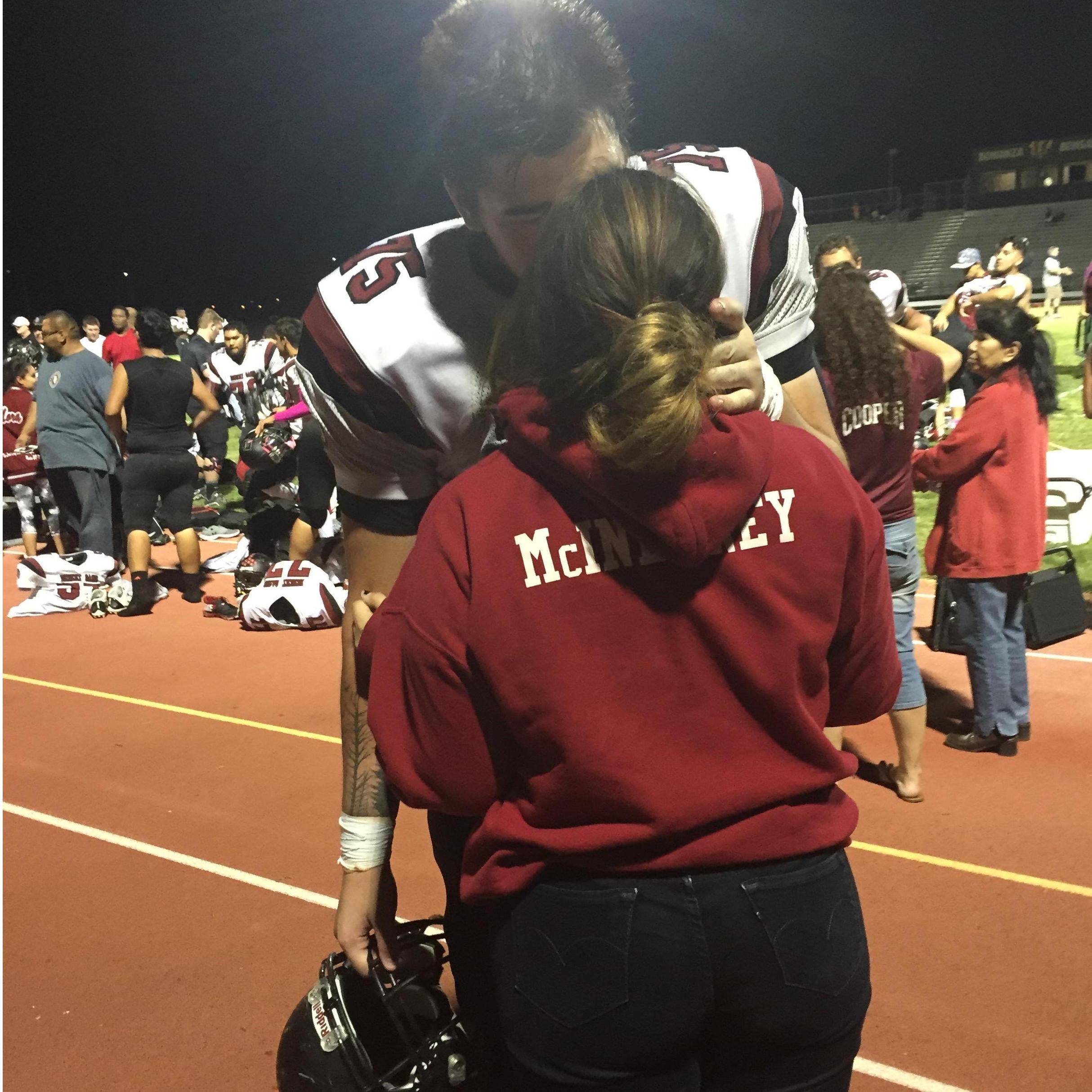 This photo was taken at the first away game after we started dating. Still one of our favorites to this day.