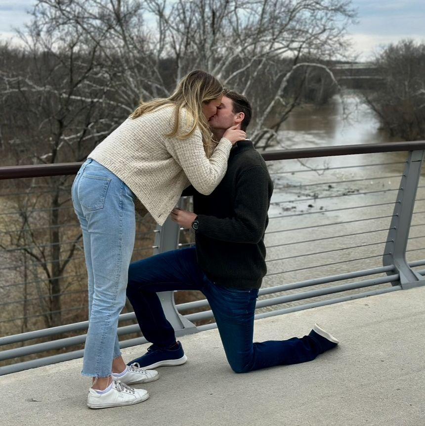 March 2025 - Ryan proposed in Bridge Park with both of our moms there :)