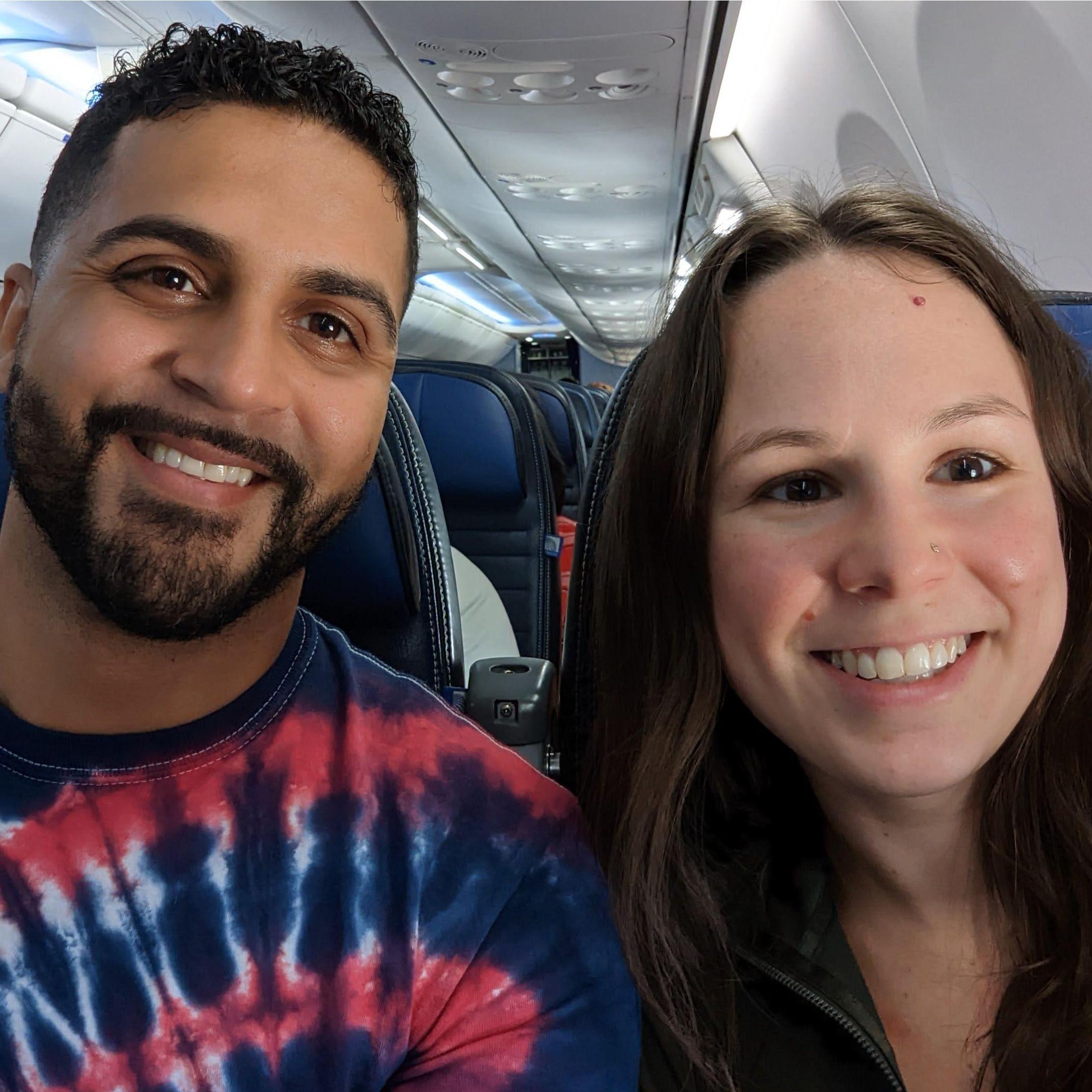Meg and Manny on the flight to San Juan! First true vacation together with the best surprise!