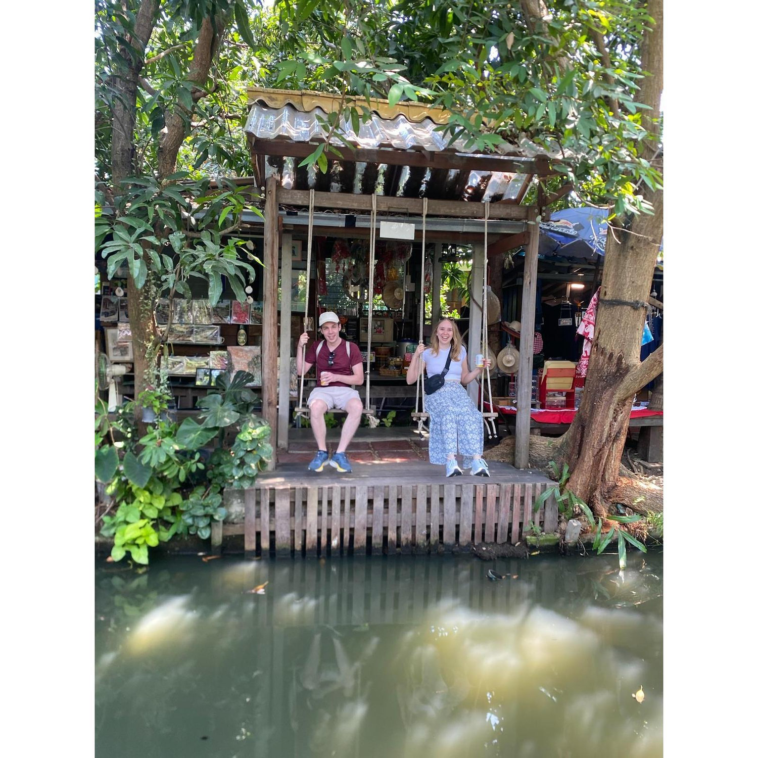 Swinging over a river in Thailand