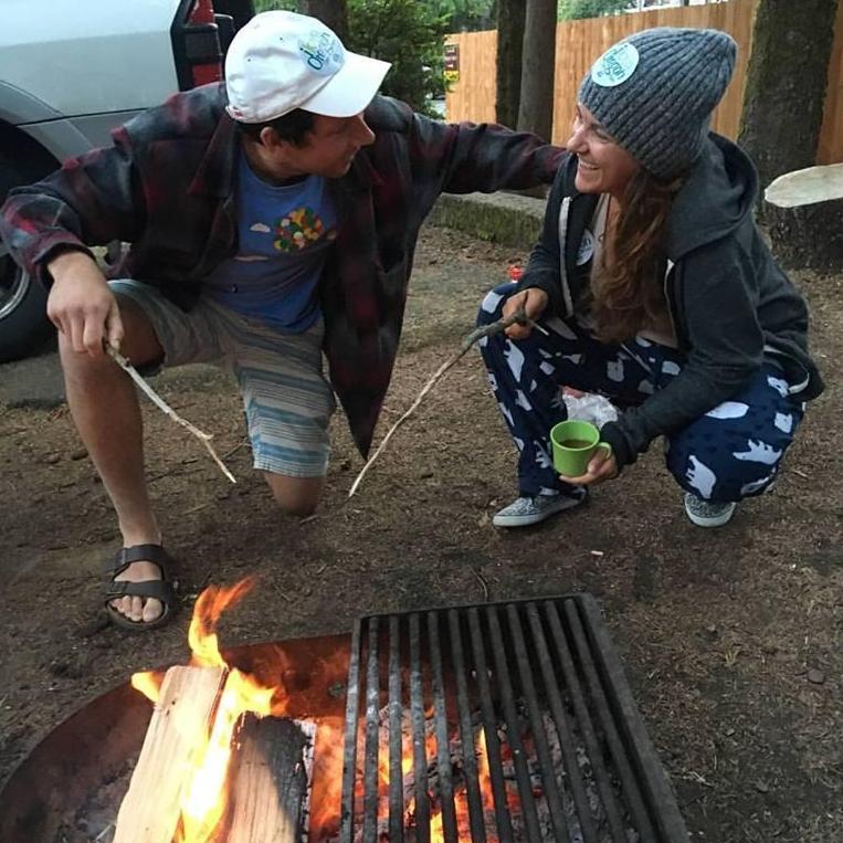 Laughing by the campfire together