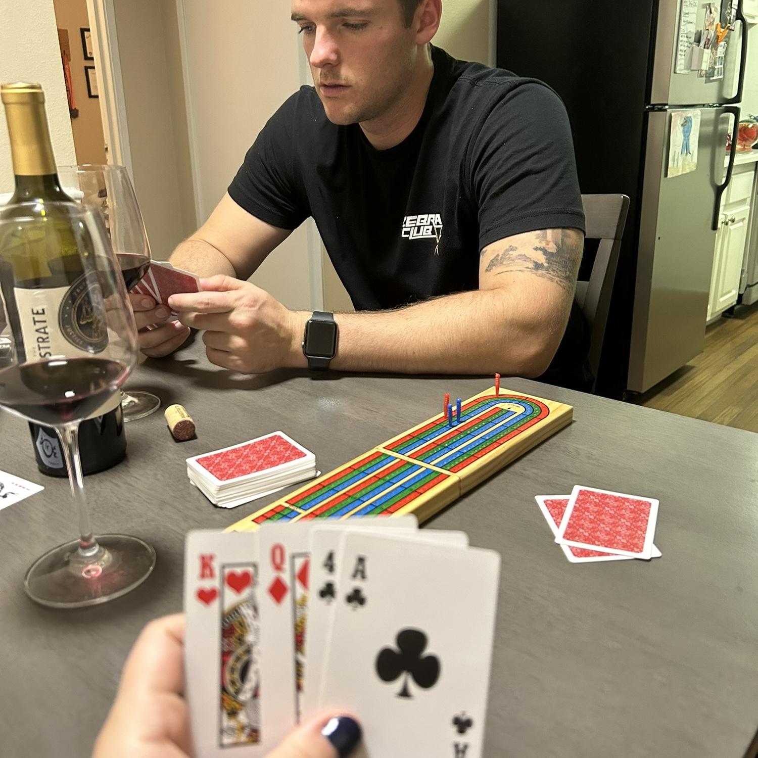 Lexi (probably) kicking Daniel's butt in a game of cribbage