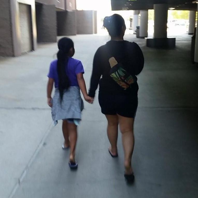 Niya & Josie walking to volunteer for party set up