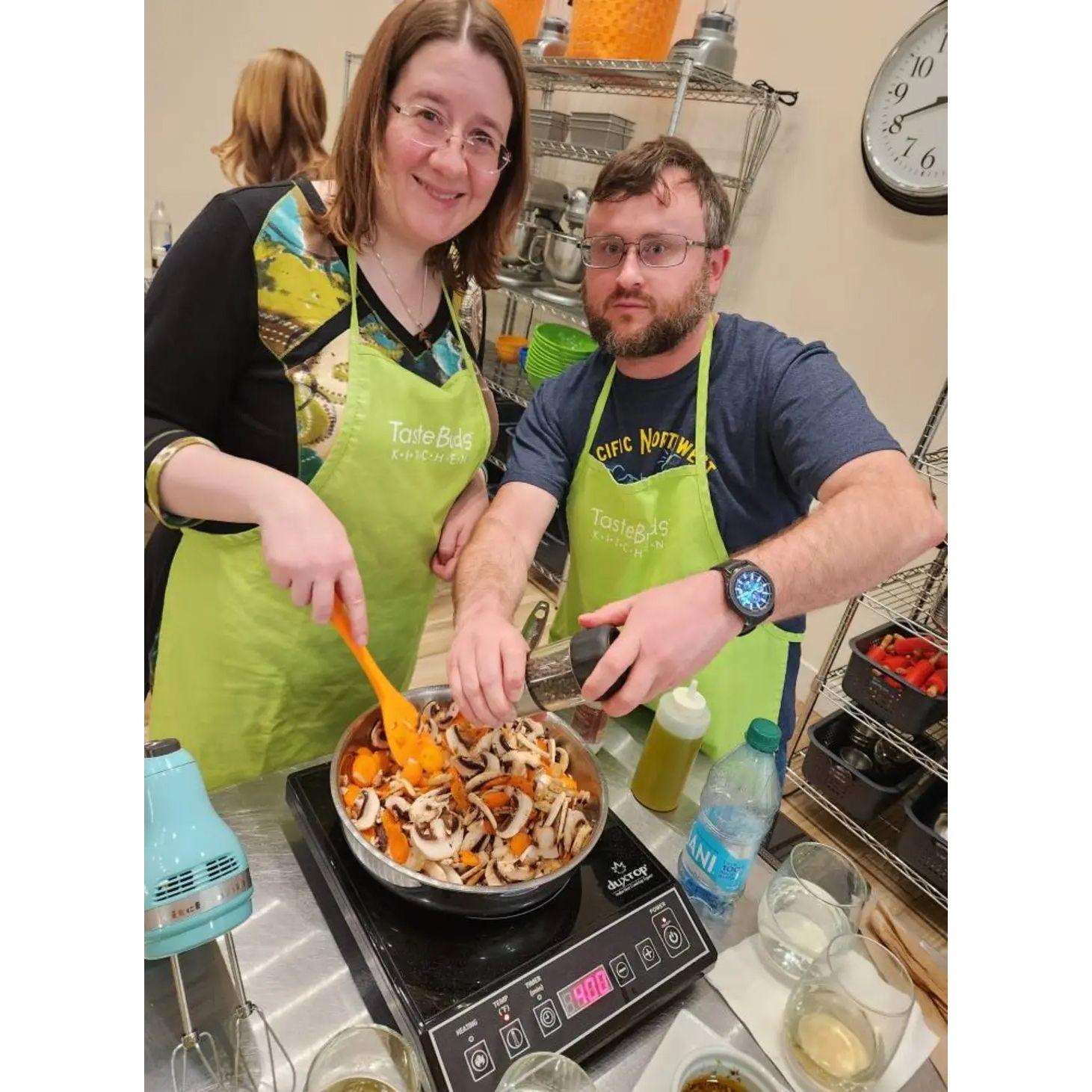 Us at one of the many cooking classes we have taken together (at Taste Buds Kitchen)