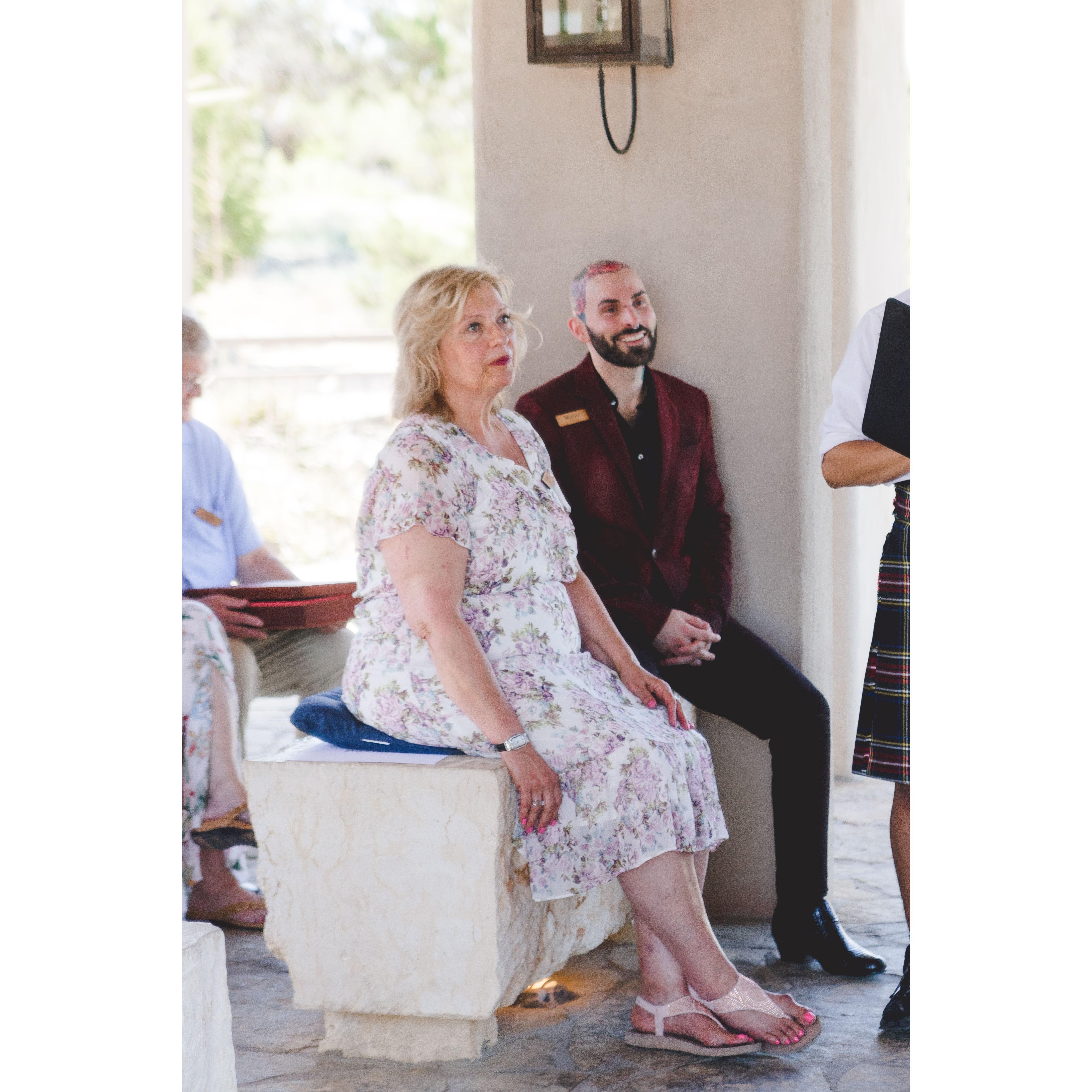 Mom Jenkins and Vnix look on.