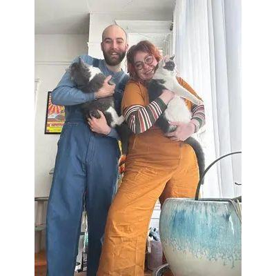 The overall twins with their fully grown kitty cats