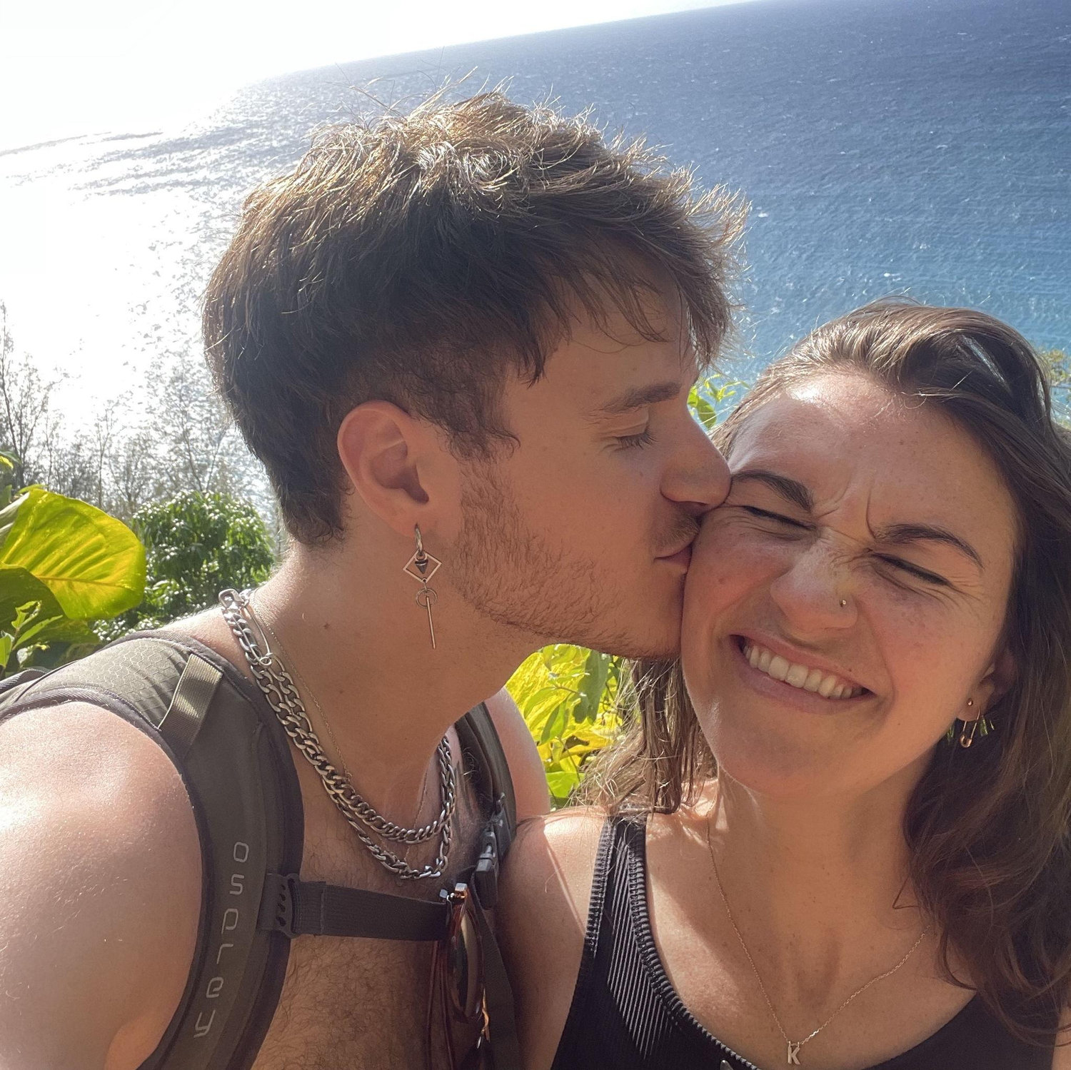 Stopping for a sweaty smooch on the way to Hanakapiai Falls in Kauai. Fun fact, the first time we ever swam together was under a waterfall (2022).