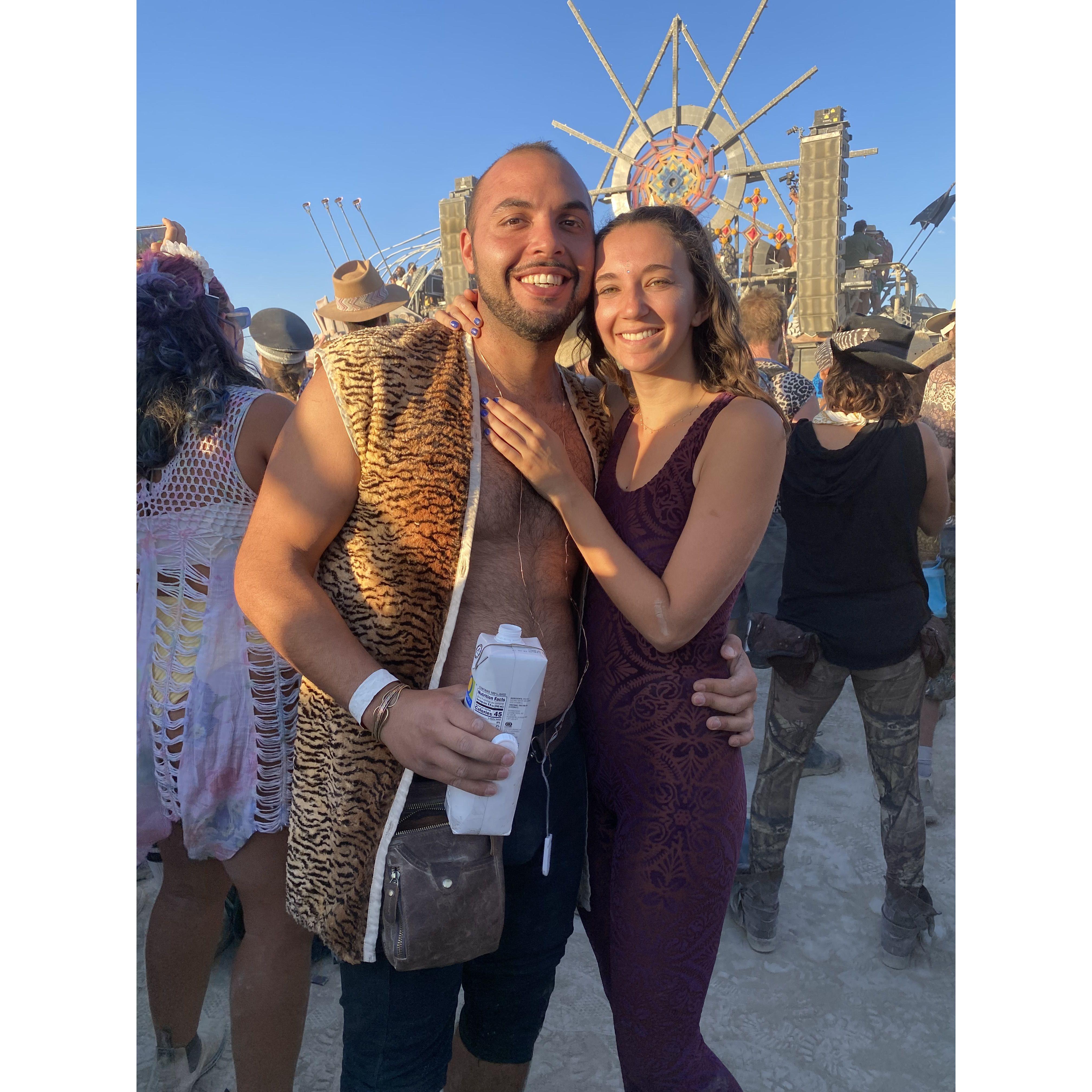 Our first burning man in front of our favorite art car (Mayan Warrior )watching our favorite DJ (Monolink) drinking our favorite hydration beverage for the desert (coconut water)