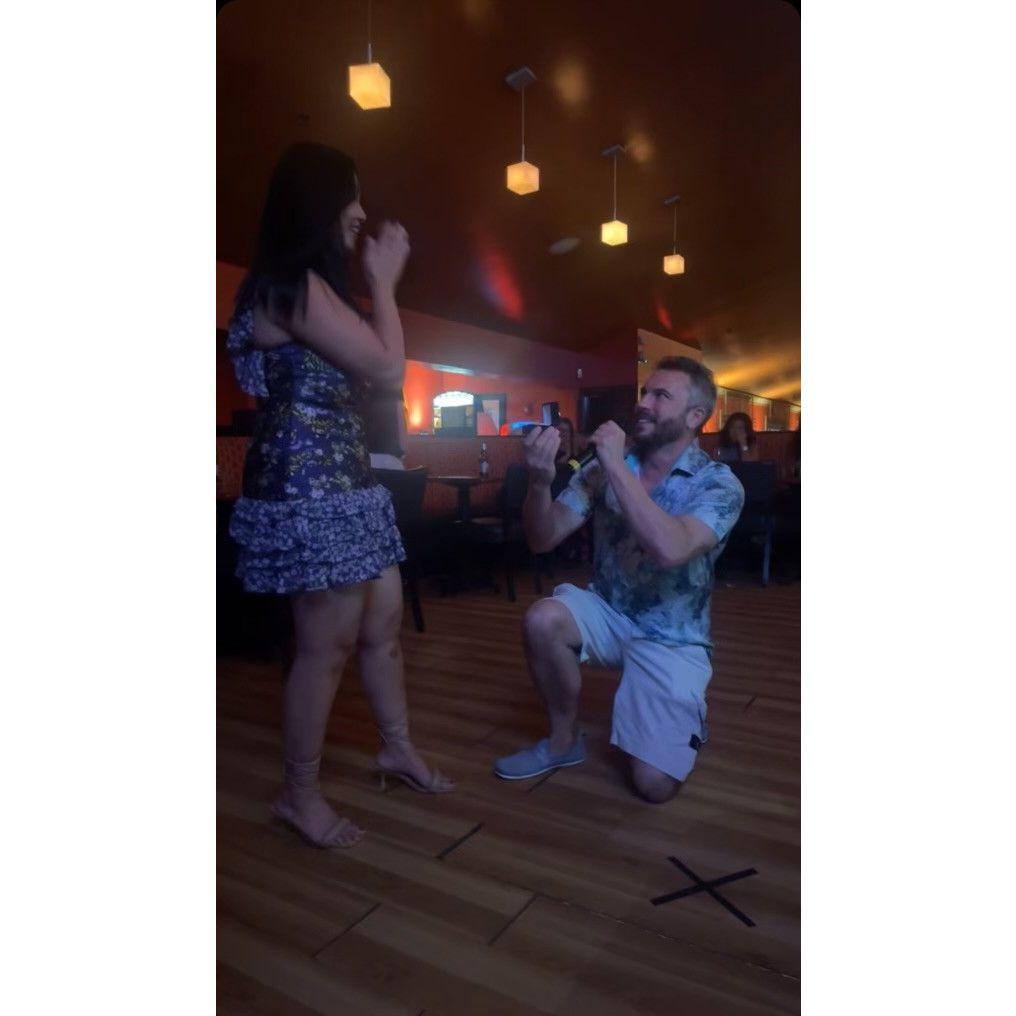 Brian got down on one knee and proposed.