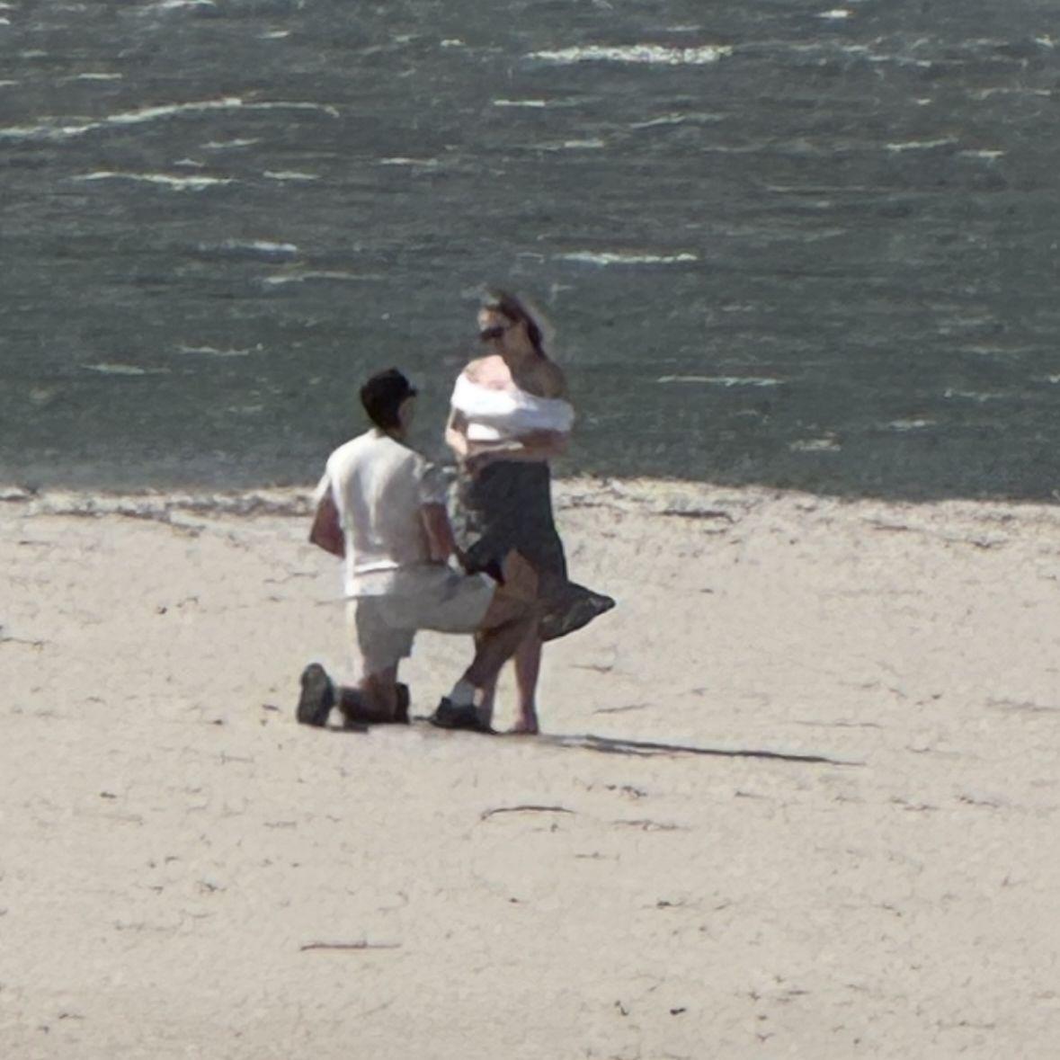 Ian proposed in Cape May, NJ, MacKenzie's Mom's favorite beach town. The moment was captured by a random stranger walking on the beach!