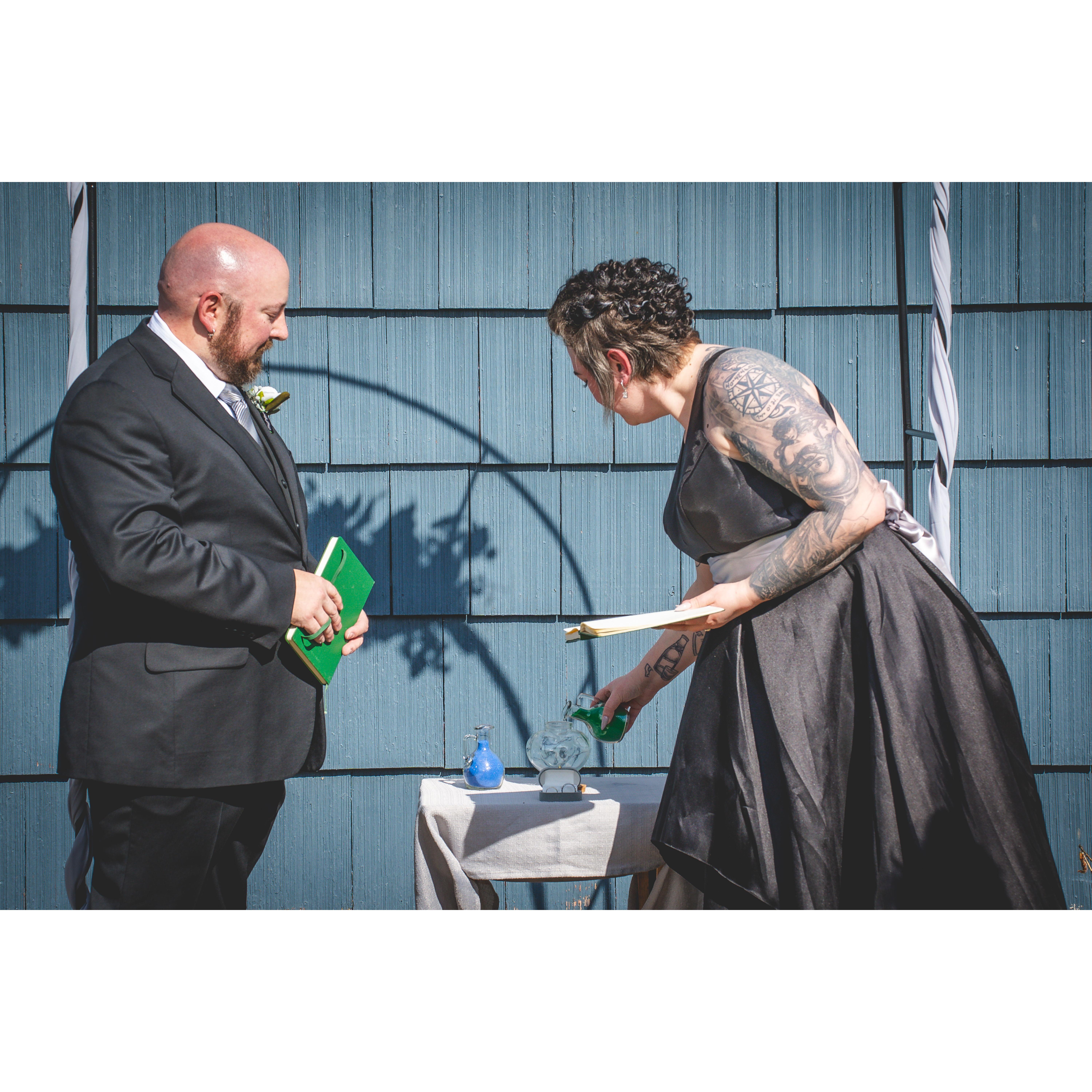 The sand ceremony represented that their lives will forever be inextricably entwined, like the grains of sand in the glass.