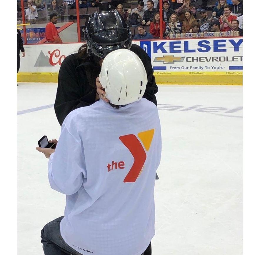 The moment Kurt proposed.. On the center ice at halftime during the Cyclones game. Liza was SHOCKED.