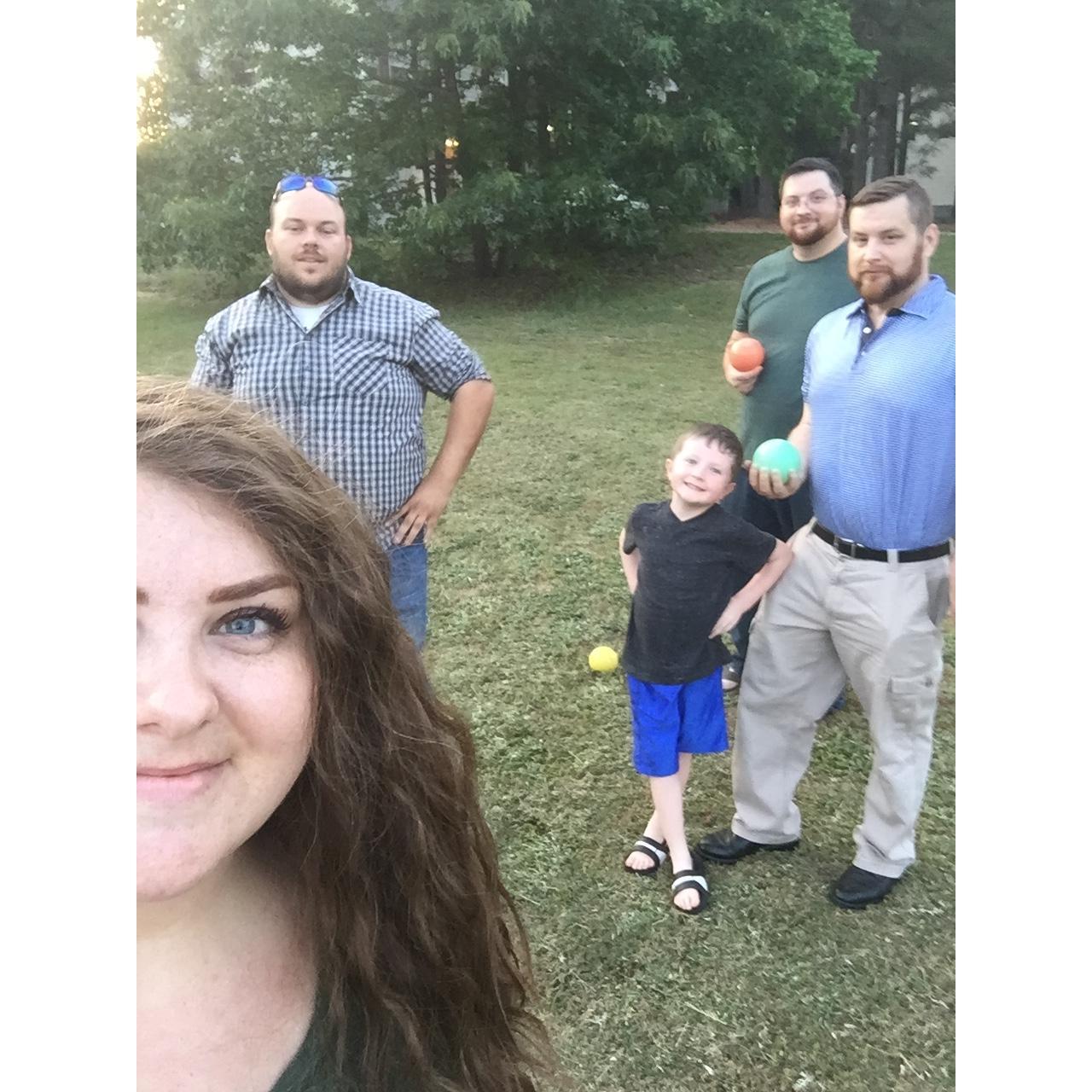 Playing Bocce Ball with my brothers and nephew.