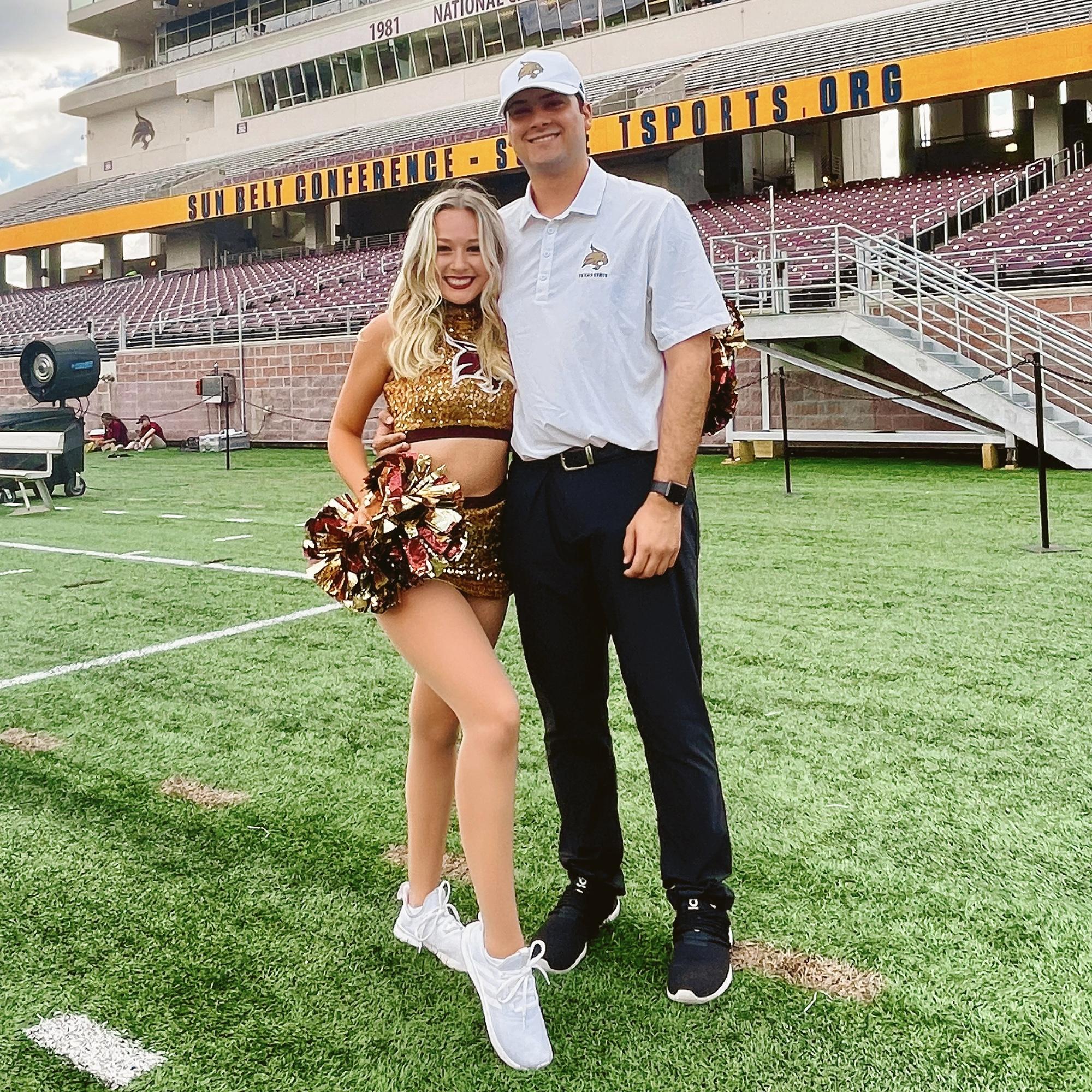 September 24th, 2022 - Coach Dylan and fourth-year Strutter Caitlin before a TXST Football home game