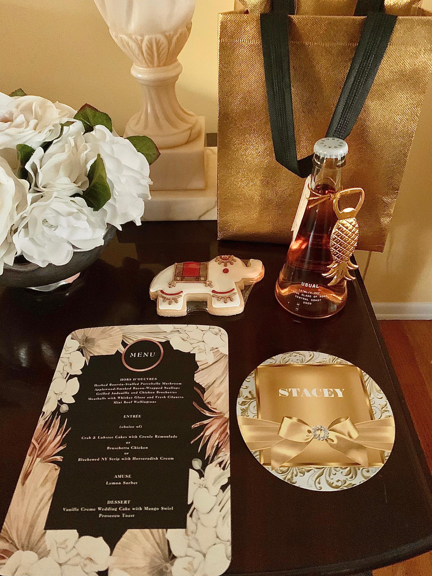 Iced elephant butter cookie favors by Baked™ (Etsy) | Semi-sparkling rosé with notes of strawberry, rose petal and rhubarb by Usual® Wines | Nush Nush® Luxury Shine Collection gift bags