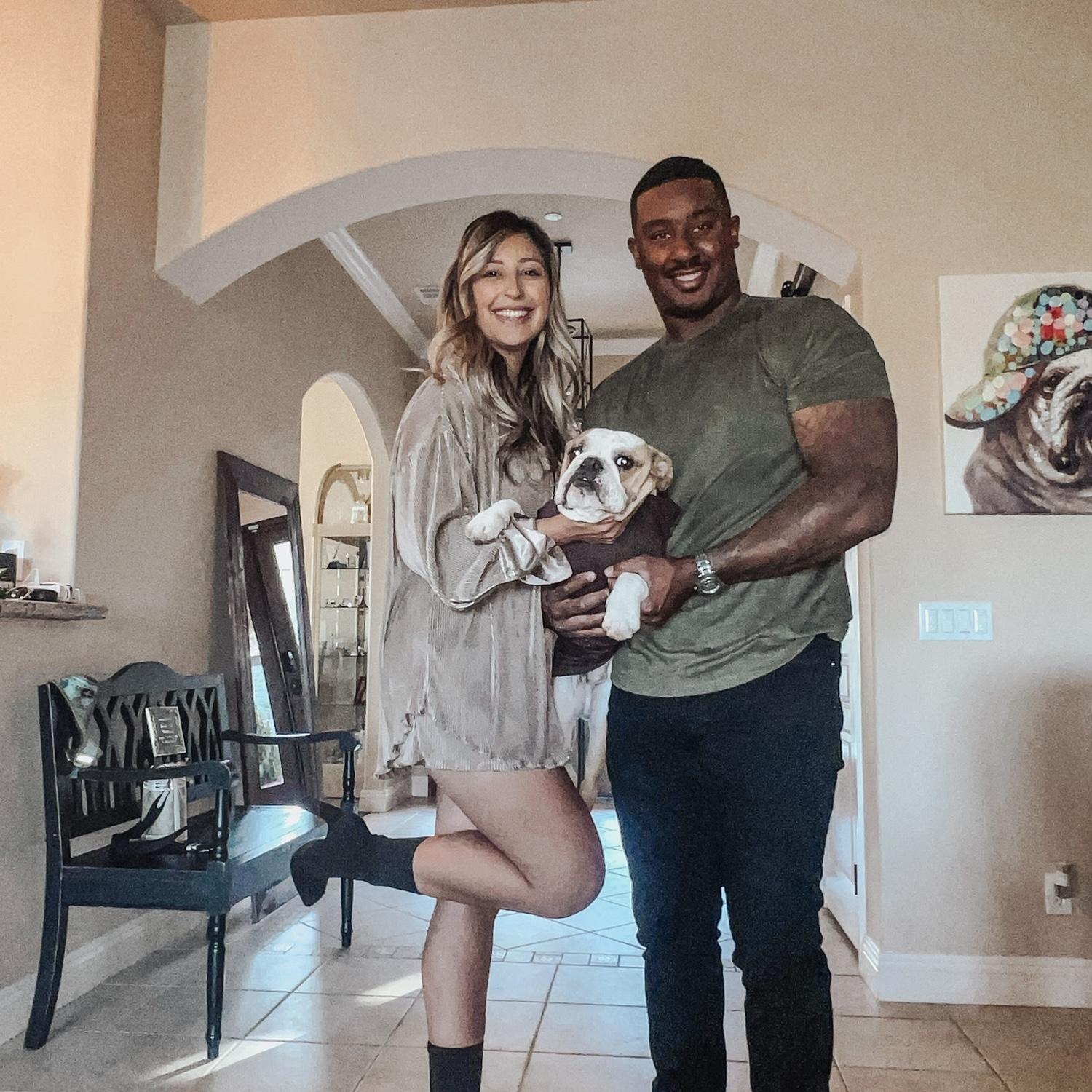 This is a picture of our little family with our fur baby, Canelo.