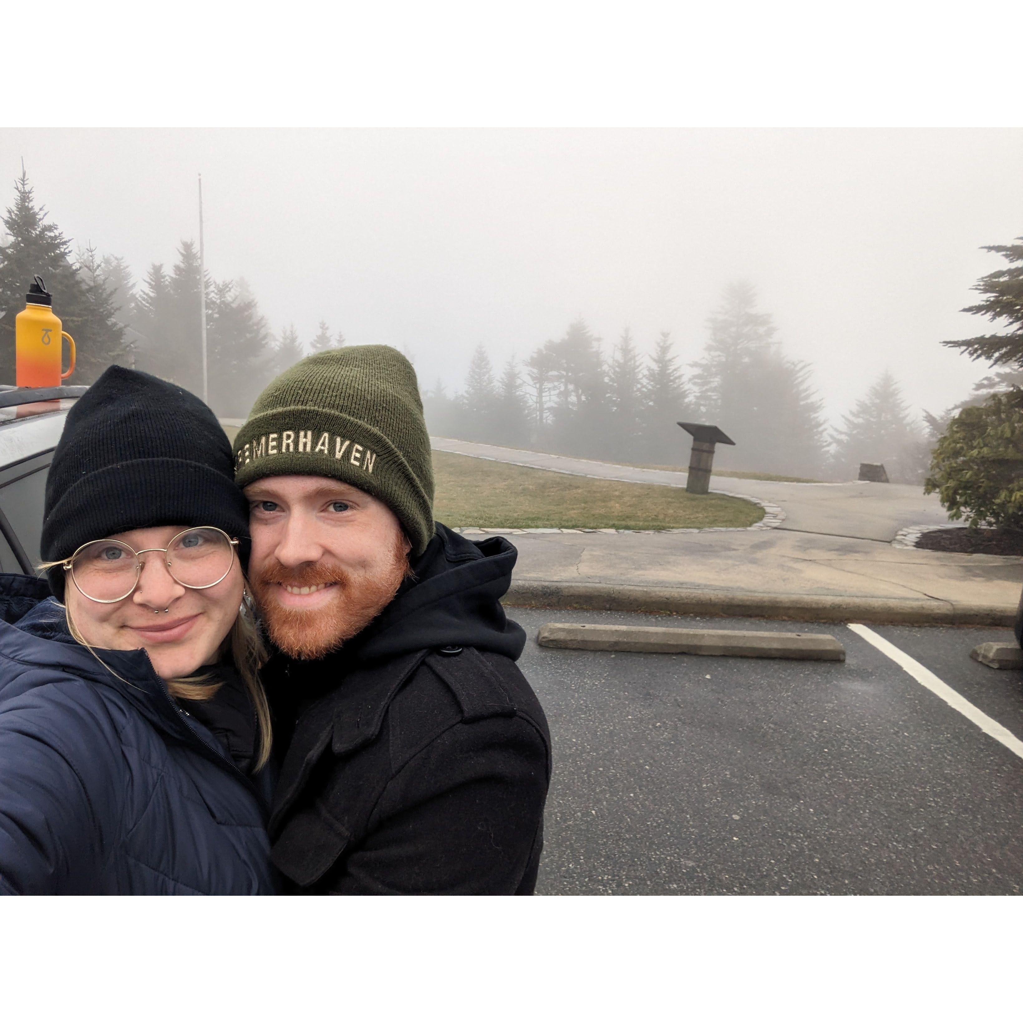 Kevin proposed shortly after this photo was taken, when we made it to the top of Mount Mitchell, the highest peak on the East Coast, on our first camping trip of 2024.