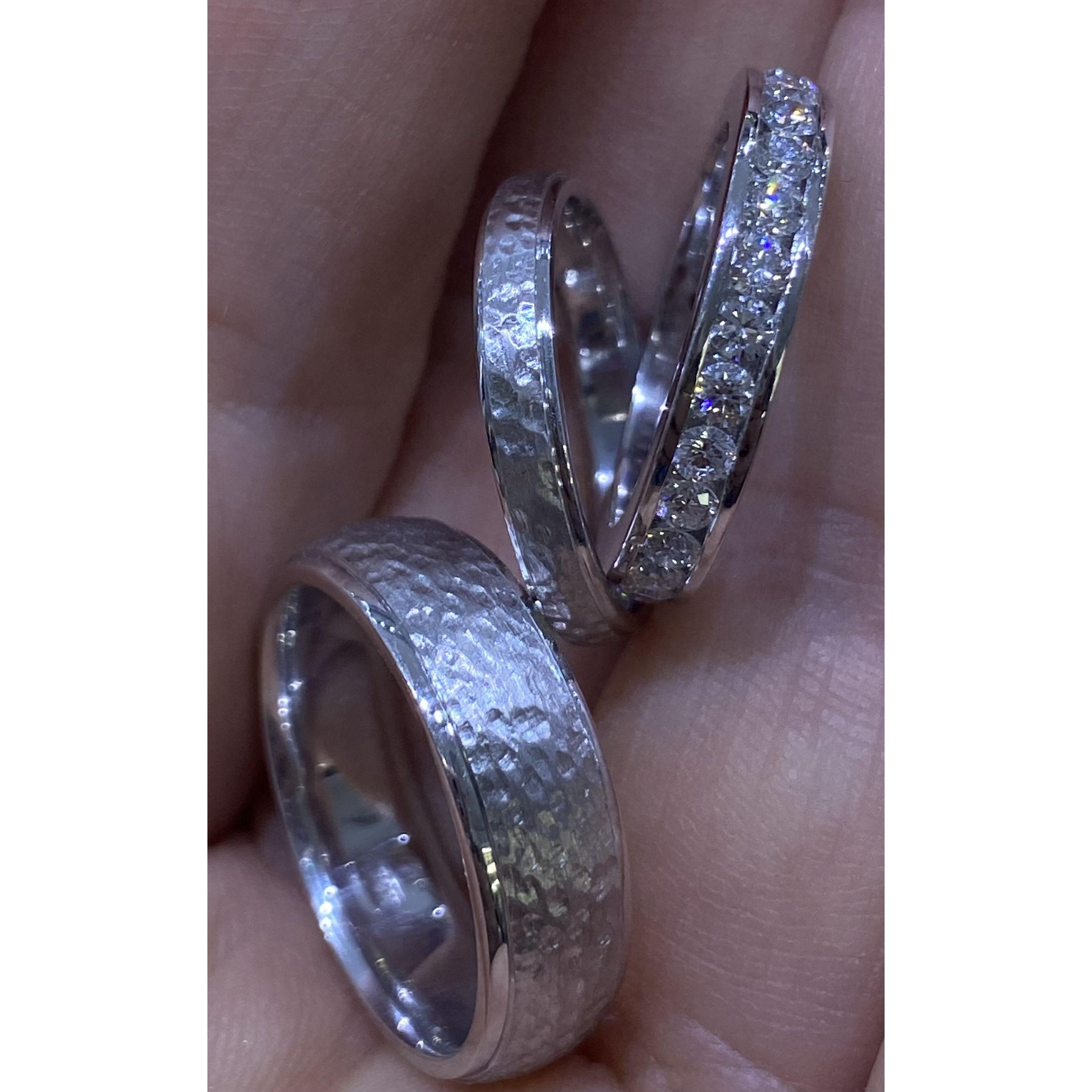 Our engagement and wedding rings.  Can't wait to see all 3 on our fingers!