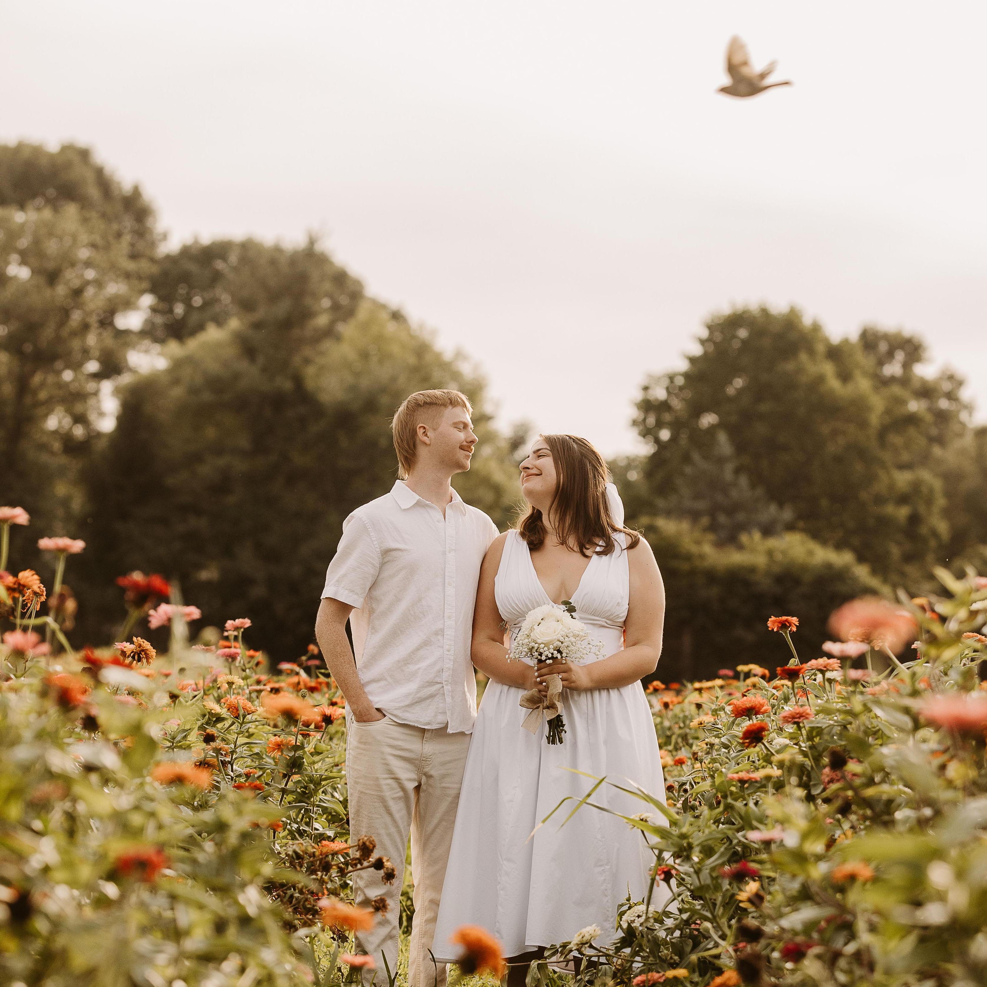 Our Engagement Photos from Maple Acres Zinnia Farm. Taken in July 2024 by Greg Bowser Photography @gregbowserphotography.