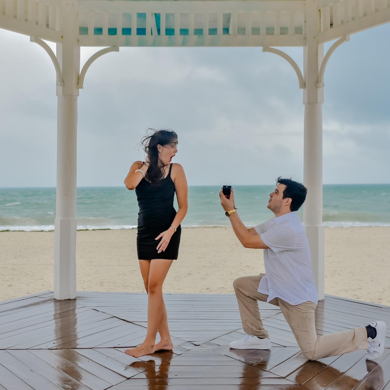 Right before this, the photographer told us "Go back to back, then turn around and smile at each other!" That's when I turned around to find Ken down on one knee!