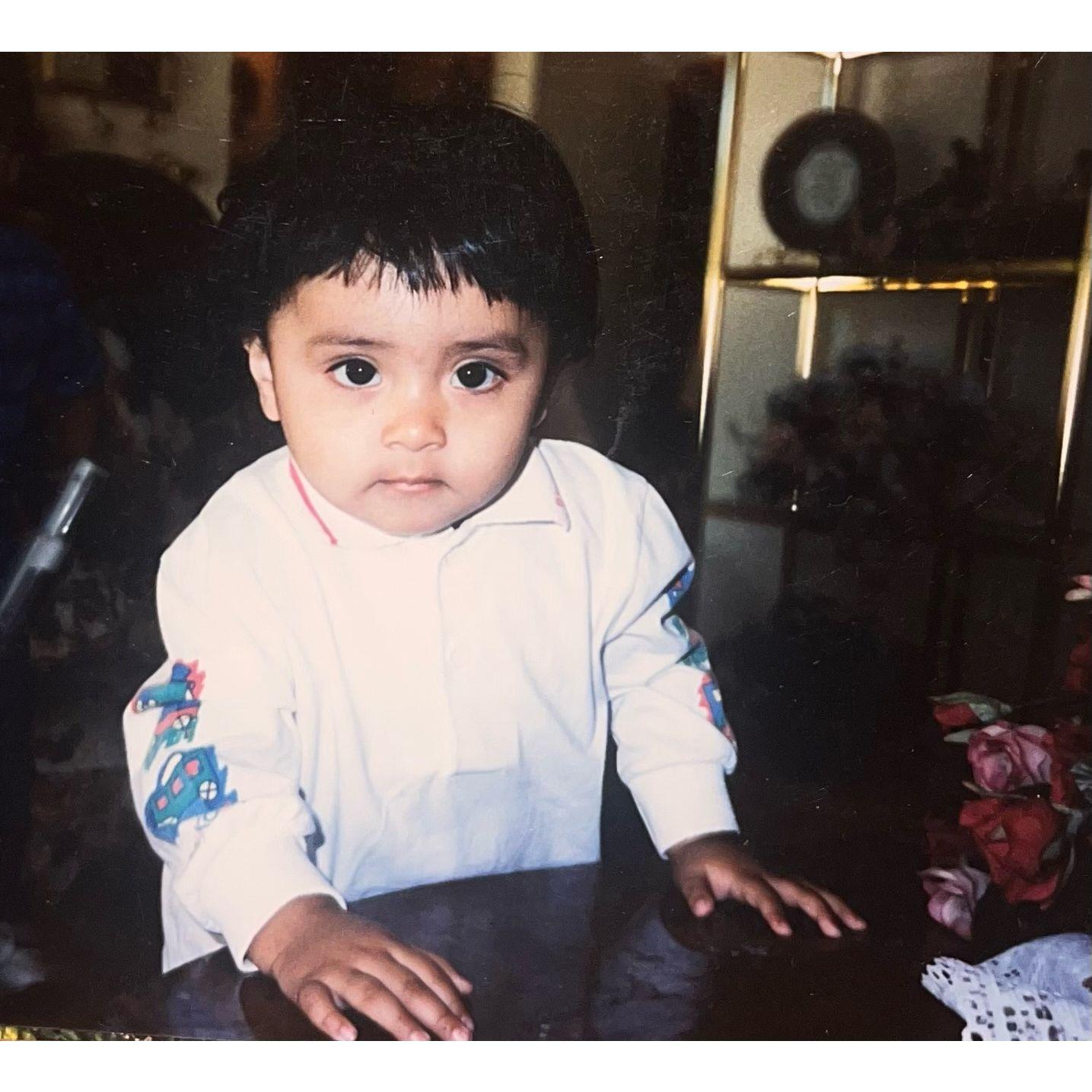 A precious photo of Leonardo as a baby, sharing a glimpse of his early ages.