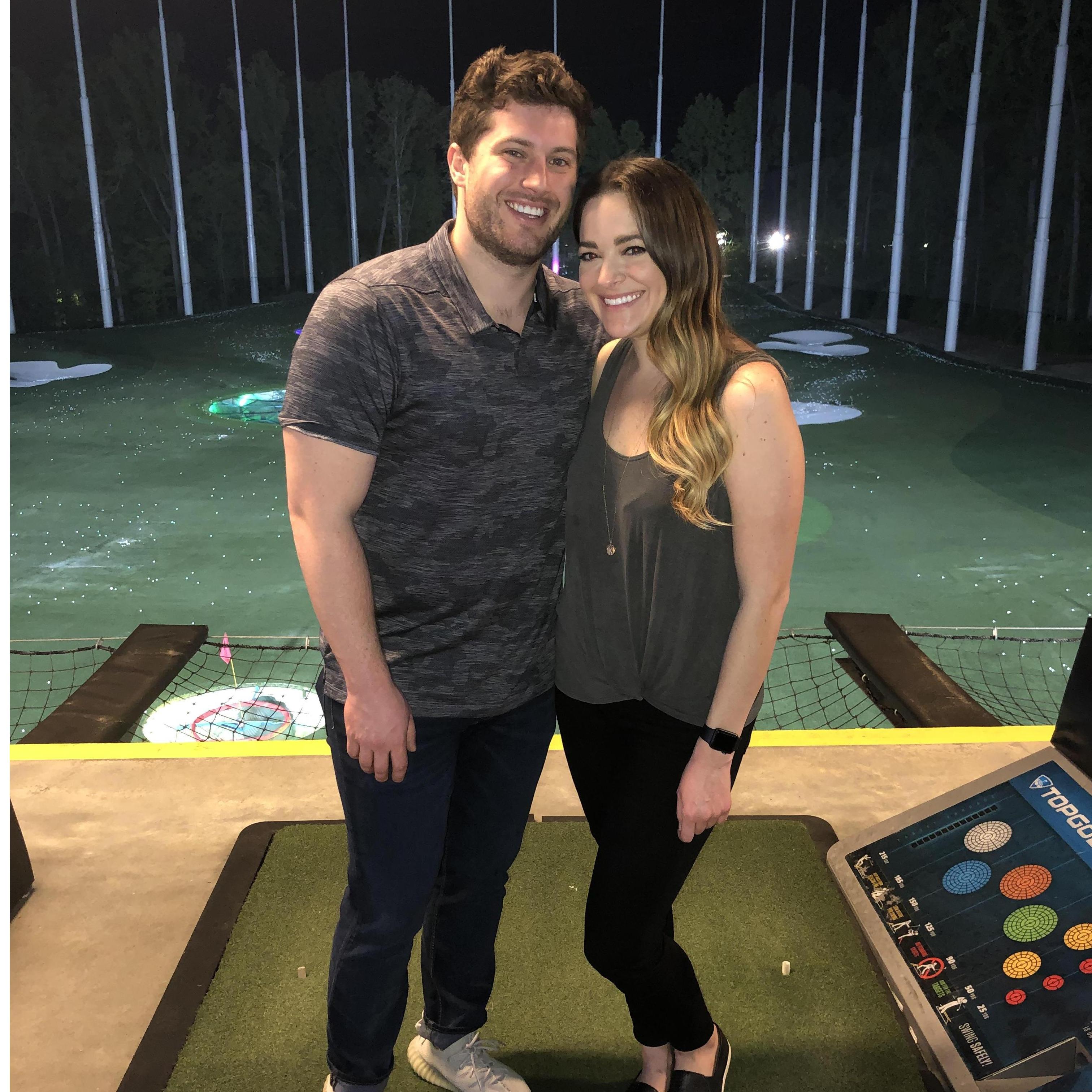 Our first picture together on our third date- Top Golf!