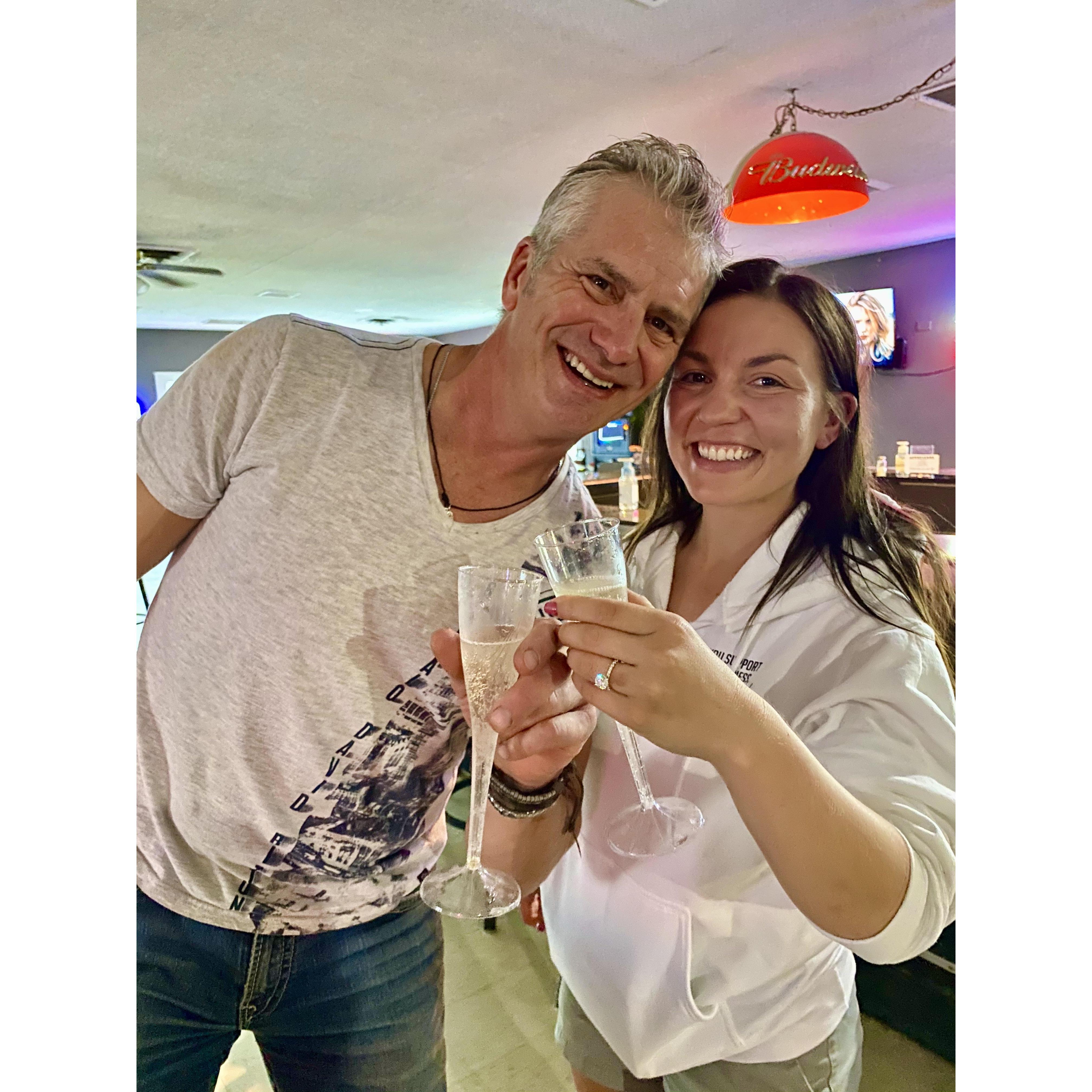 Champagne cheers because we are engaged!!