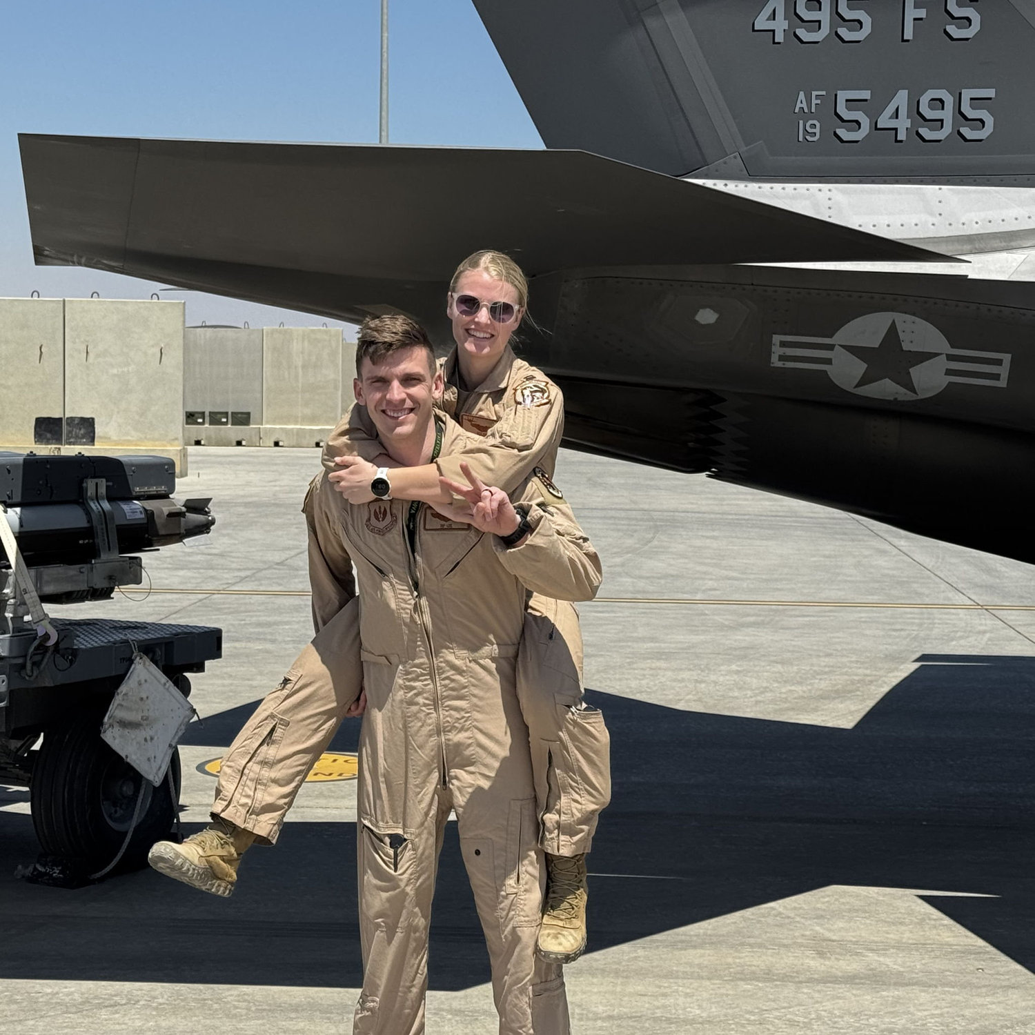 Matt and Brynn in front of an F-35