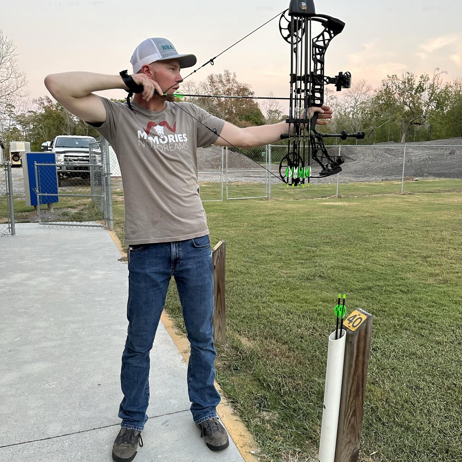 Kody shooting at the archery range in Texas