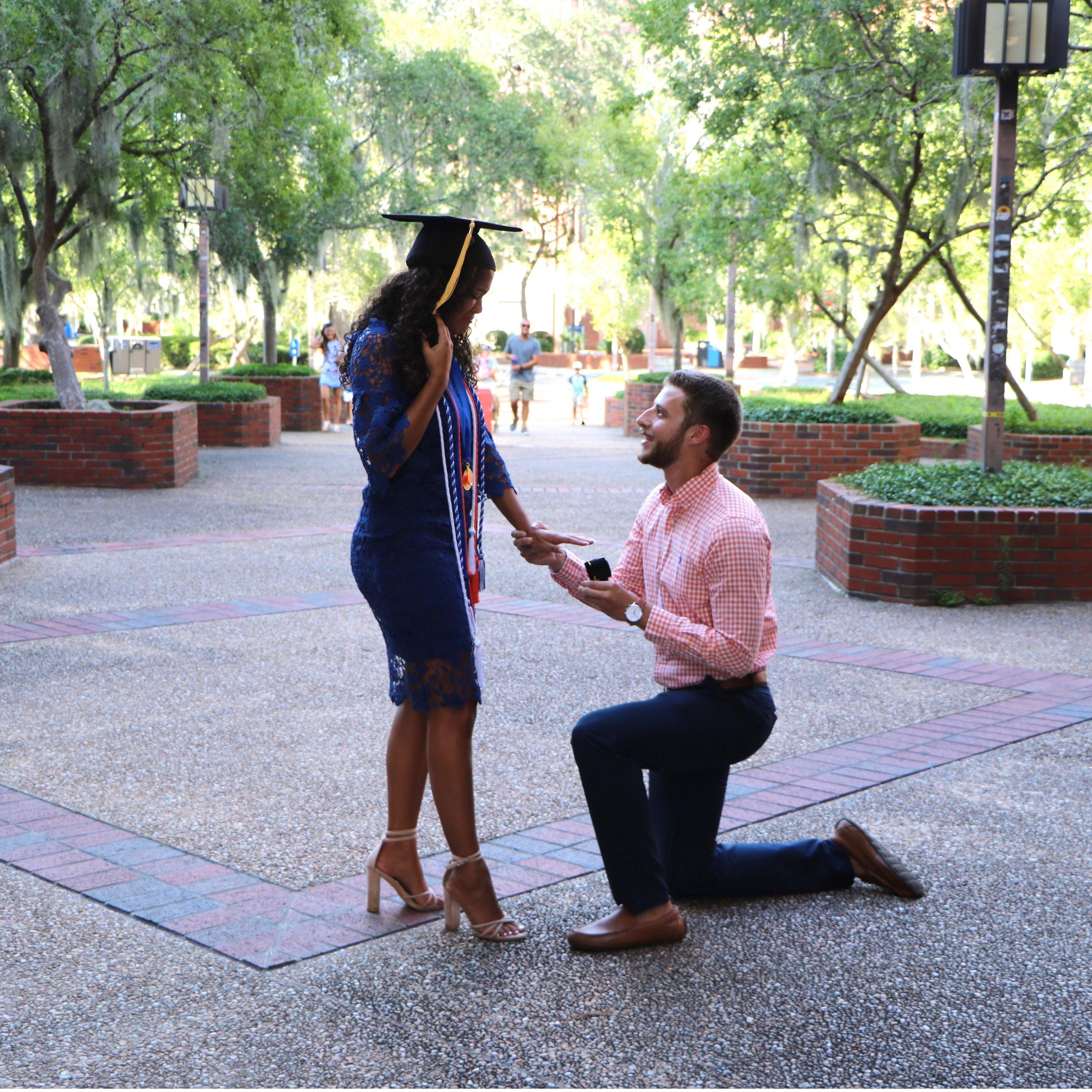 Connor popped the question while Alana took graduation pictures to make sure their families were there and to do it at their favorite place on campus!