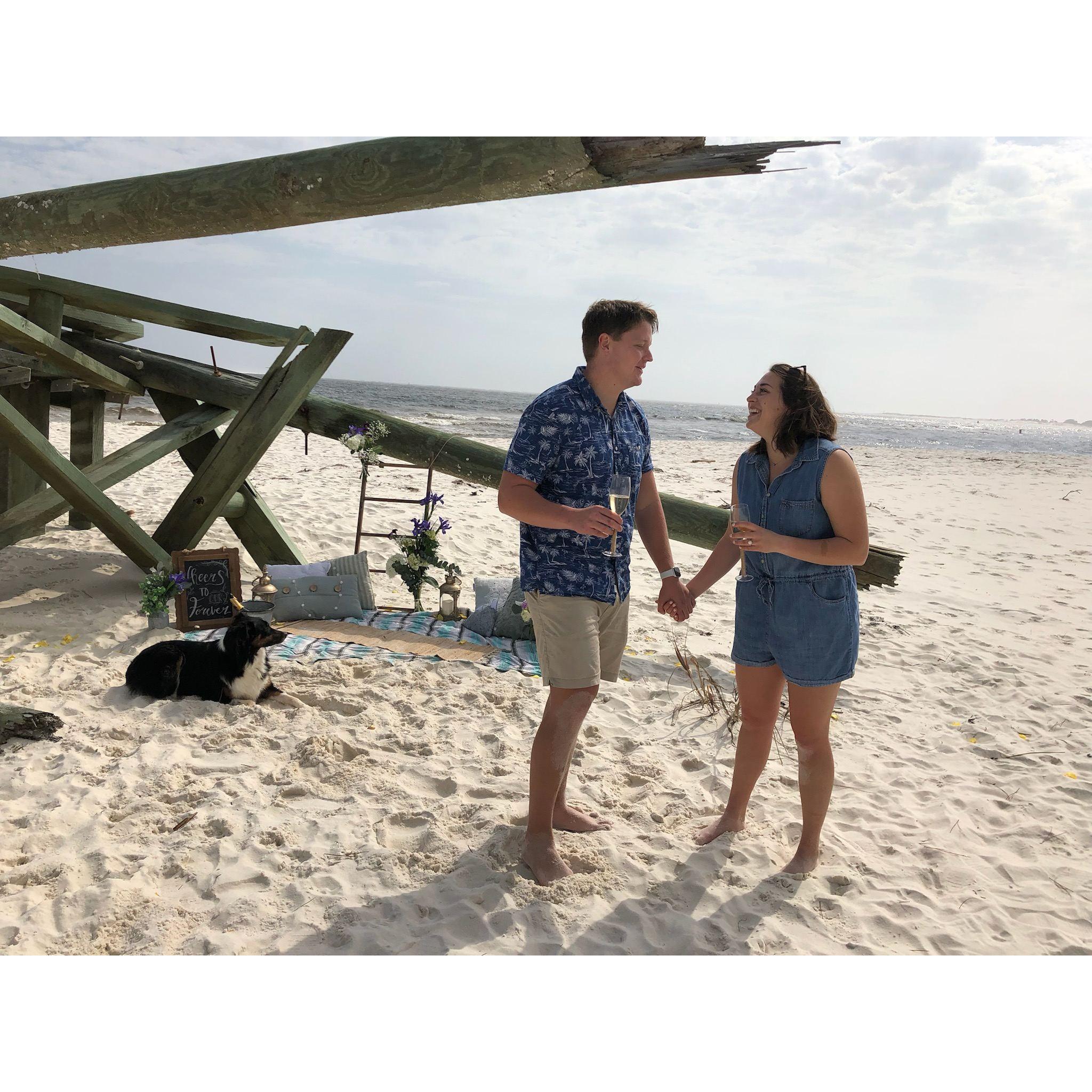When Sam proposed on our favorite beach in Pensacola!