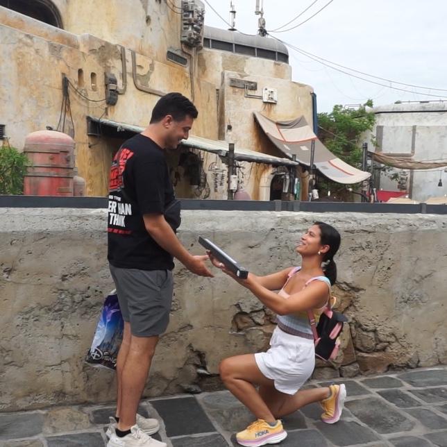 Marissa proposing to Tony with a lightsaber
