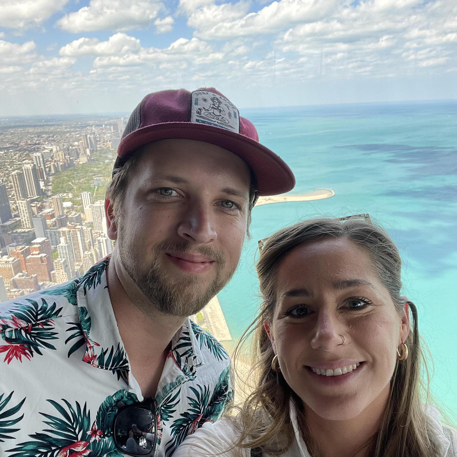 We love traveling! Covid has been a reality for most of our relationship, so we've had limited opportunities, but we've made the most of it! This is the top of Willis (Sear's) Tower in Chicago.