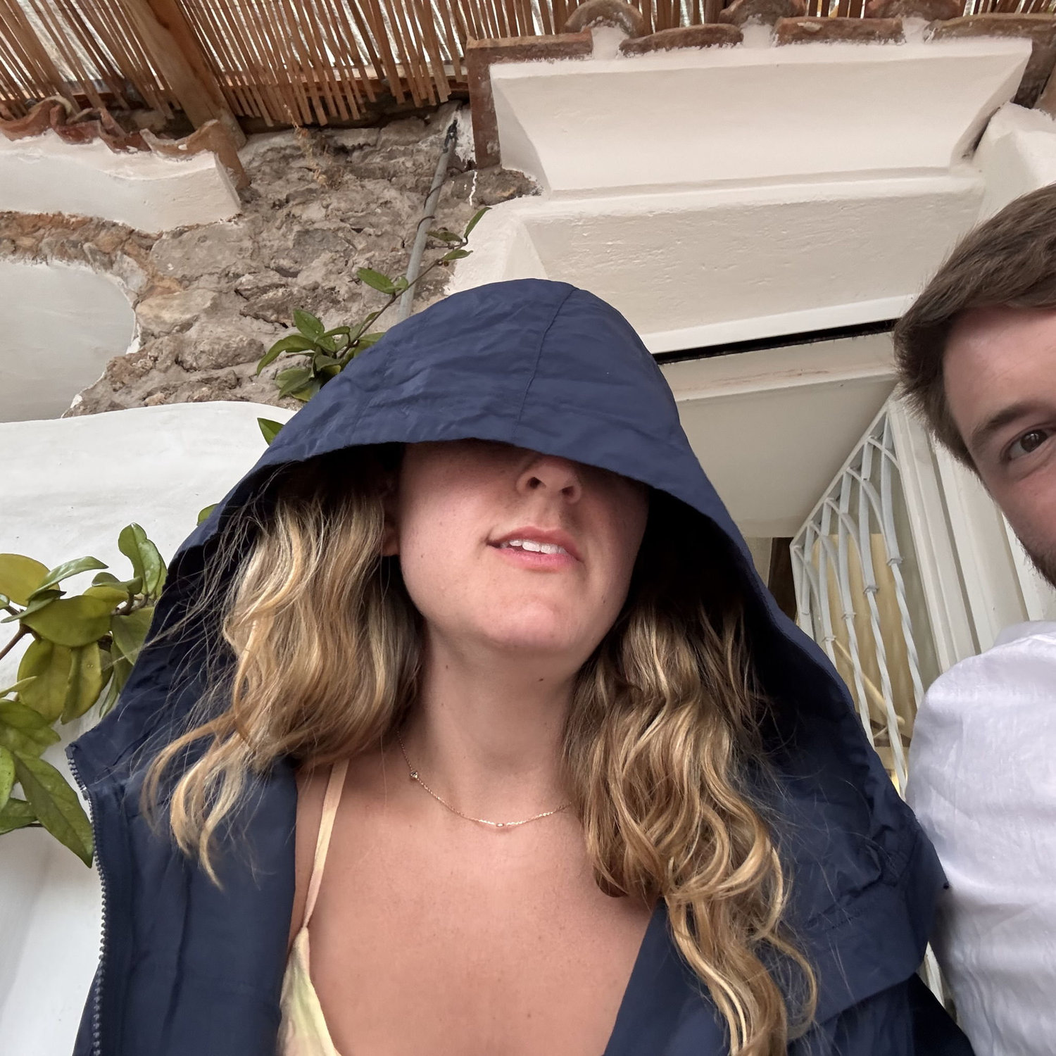 Jess hiding from the rain before our engagement shoot in Italy