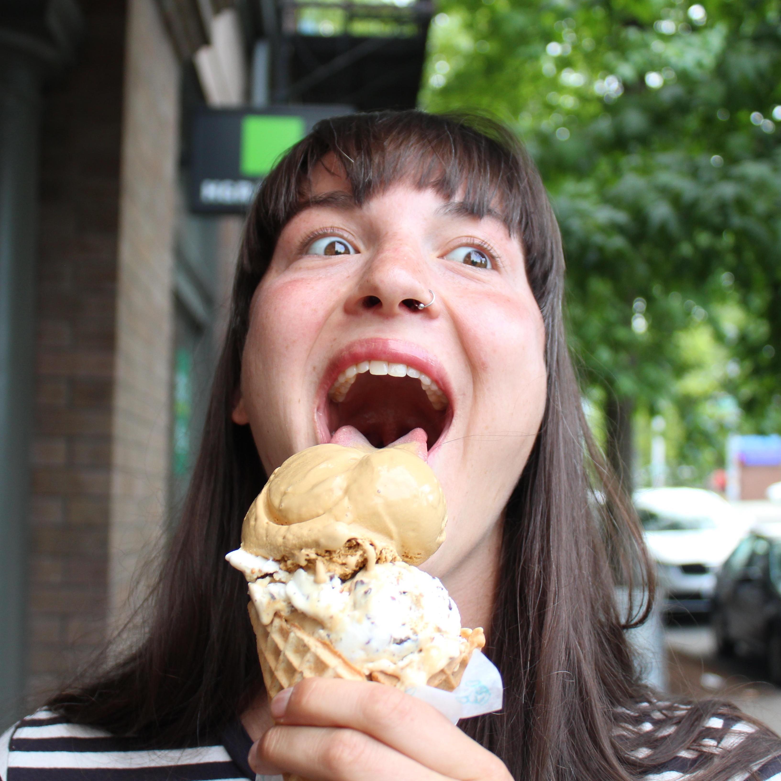This picture was taken outside of a cat bar (a bar where you can pet cats) in Seattle, WA. Was it the ice cream, or the cats? Even she doesn't know.