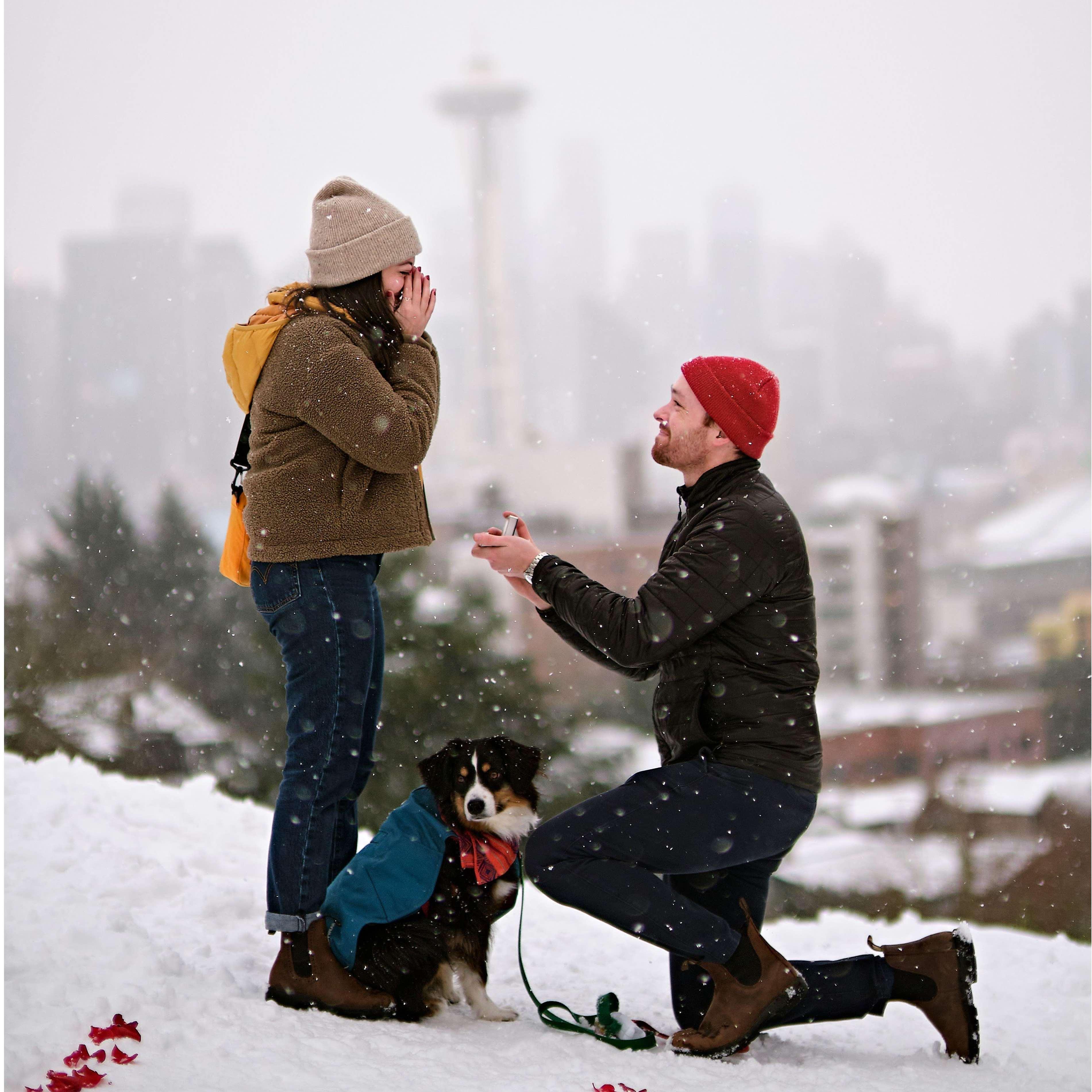 Thomas proposed in the snow (!) surrounded by our friends at Kerry Park in Seattle.