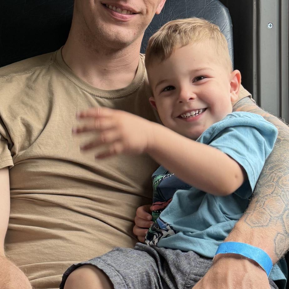Ethan and Roman riding a train (Roman loves trains)
