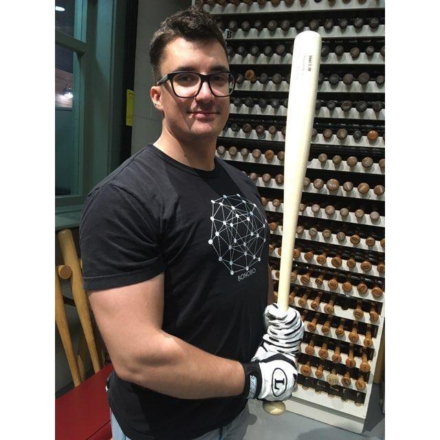 Kevin holding one of Joey Votto's bats at the Louisville Slugger Museum- our first vacation together