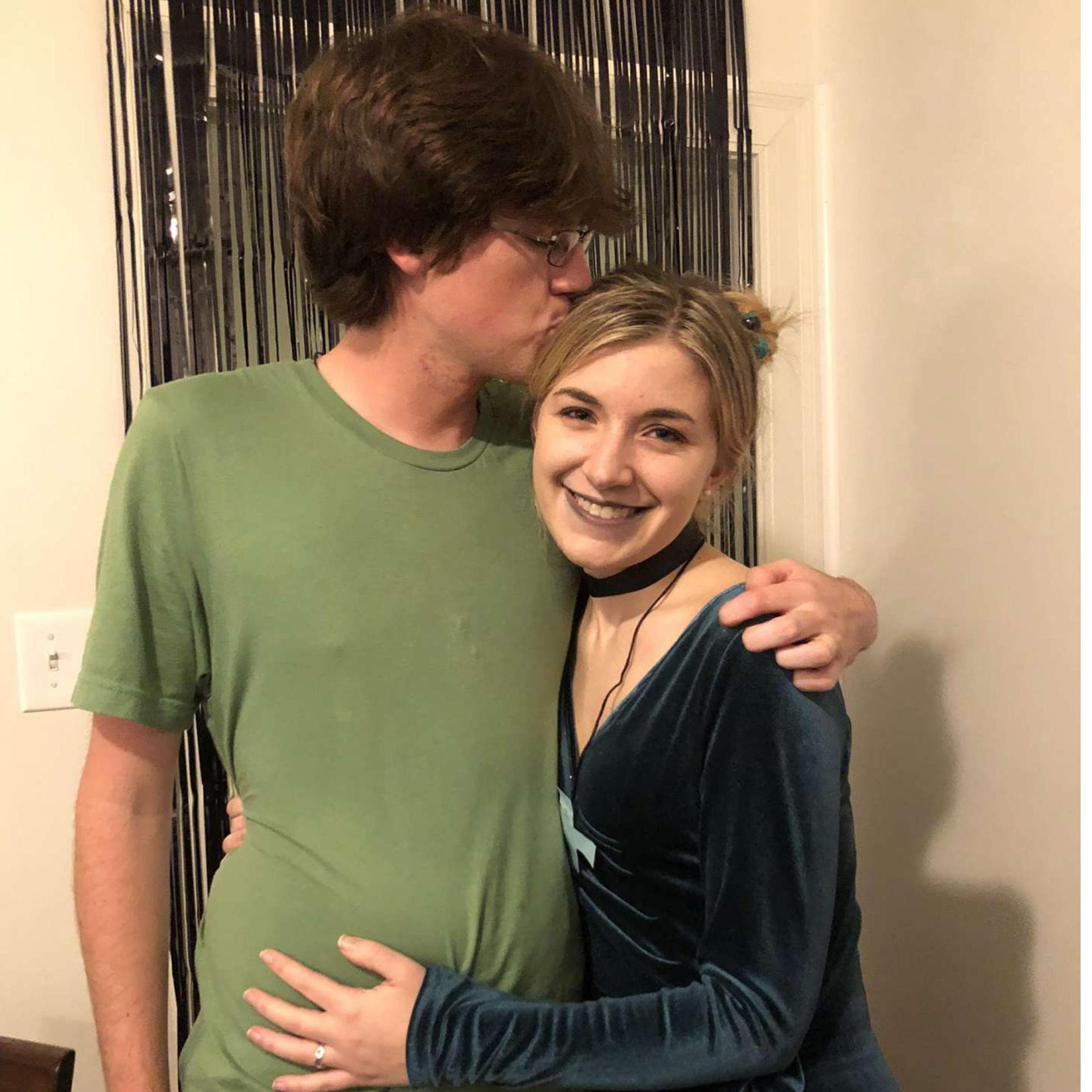 This is a picture of us on Halloween in 2021 at a Scooby Doo-themed party. Alex dressed as Shaggy, and Cate dressed as Dusk from the Hex Girls.