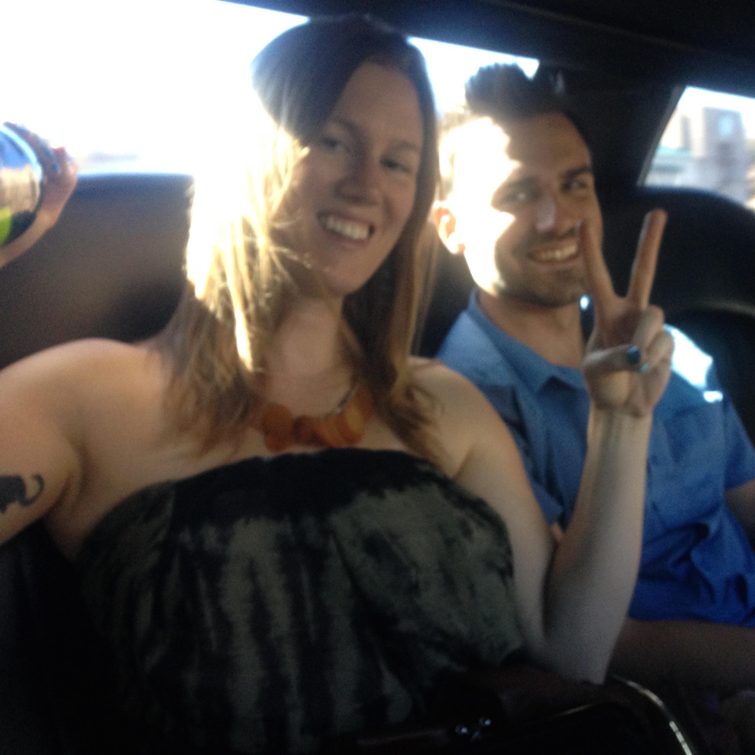 In the back of the limo driving to winery's.