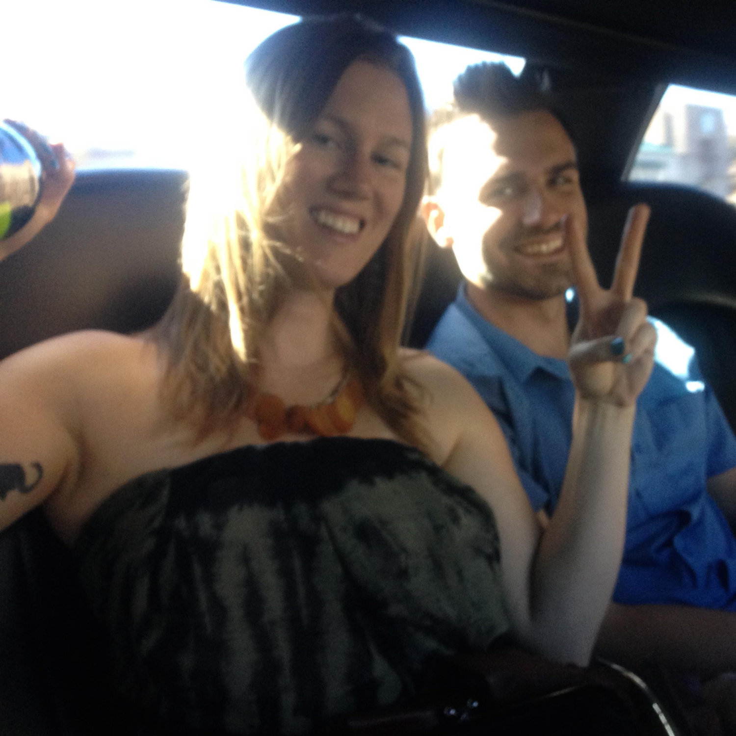 In the back of the limo driving to winery's.