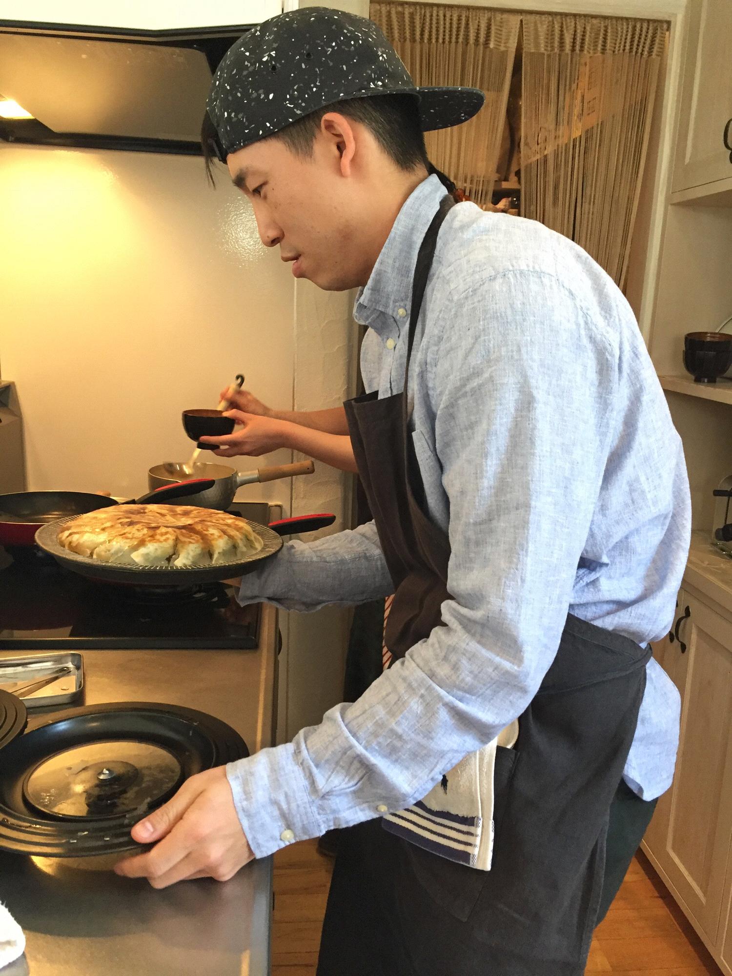 Brandon, the chef, presenting the gyoza he made in Japan