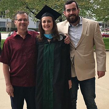 Kaitlin, her Dad, and Jack outside of her Master's Graduation Ceremony at Cleveland State (2018).