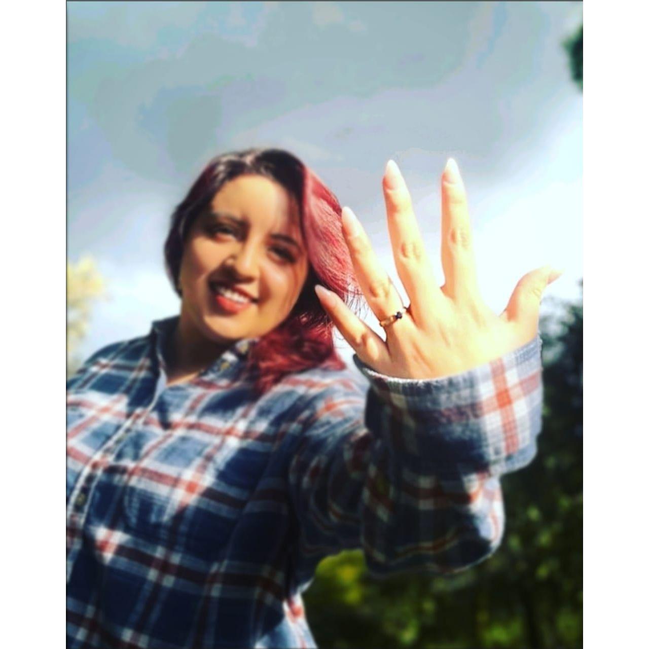 Showing off my ring during our engagement shoot. Enseñando mi anillo de compromiso.
