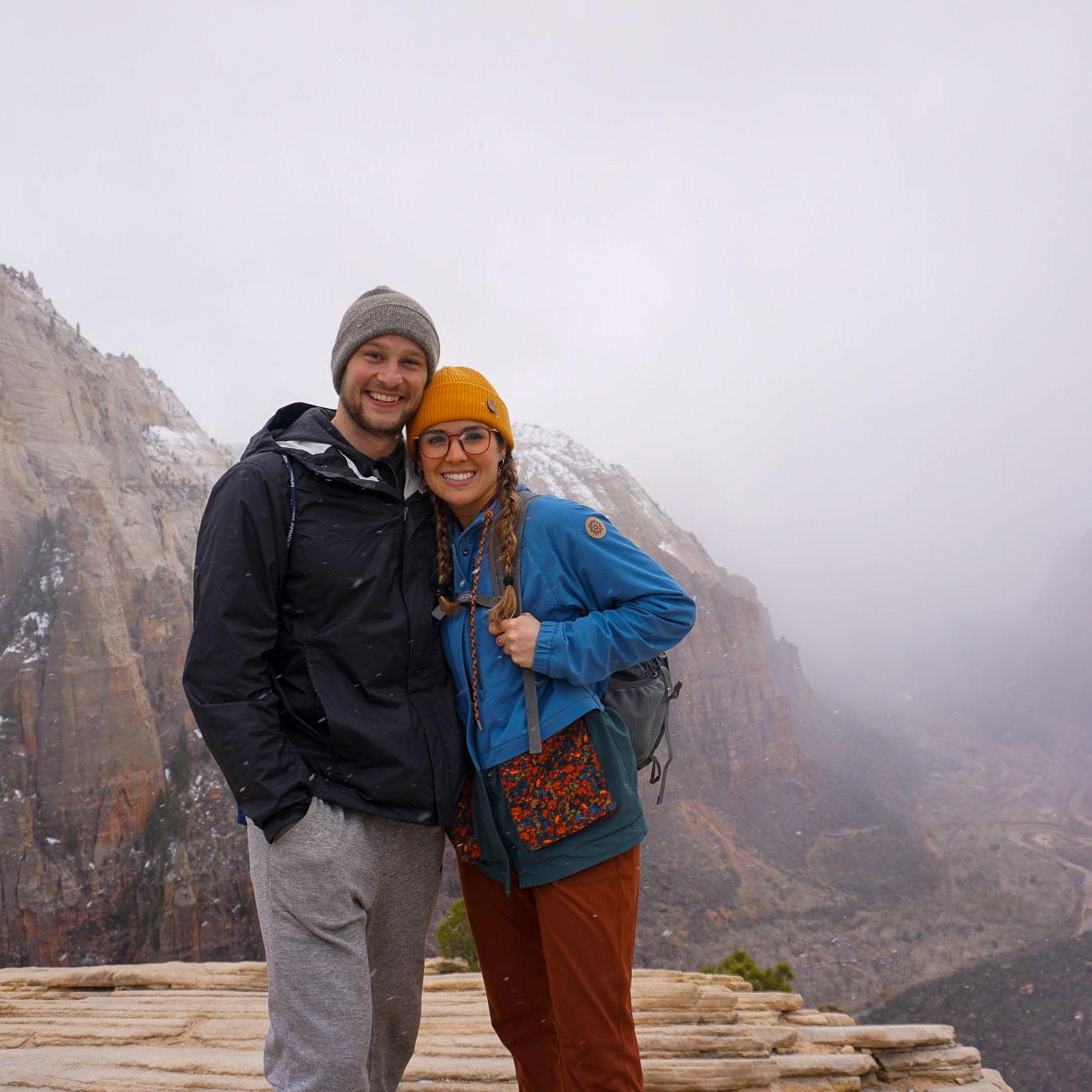 At the top of Angel's Landing in Zion National Park DURING a snowstorm (not pictured: Danny's positive attitude while Elexi lost all color in her face wondering how she was going to trek back down).