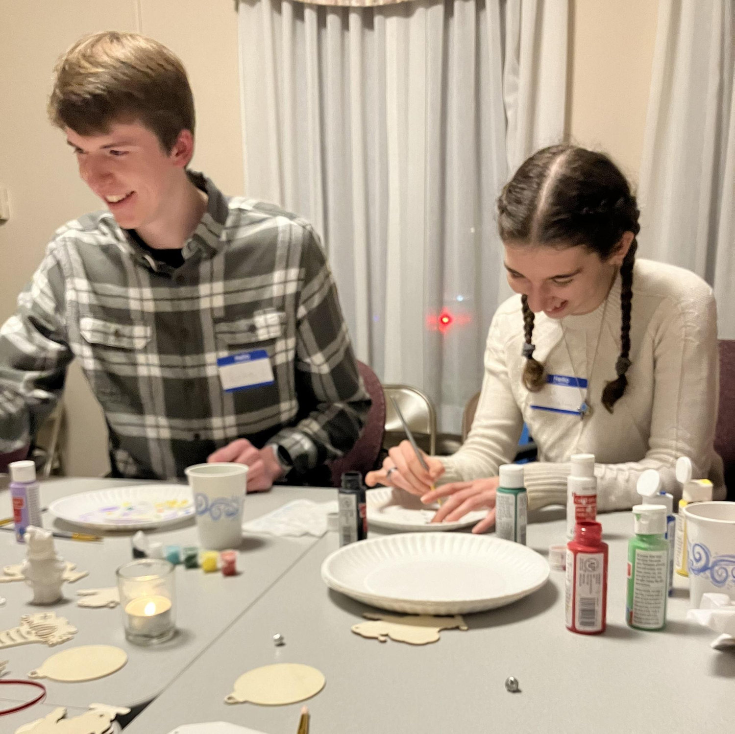 can you tell we like each other? ... our friend Amanda could too, so she snapped this picture at the Converge Christmas Party, 2024! (Elijah was still trying to be in denial lol)