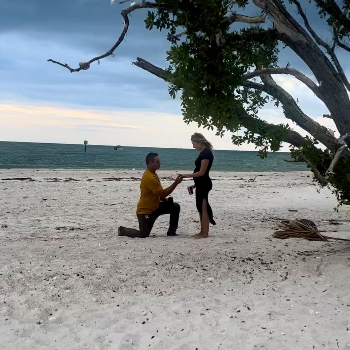 Miles got down on one knee at the Wiggins Pass Shell Tree with their close friends (Megan, Mike, Casey and Pat.)