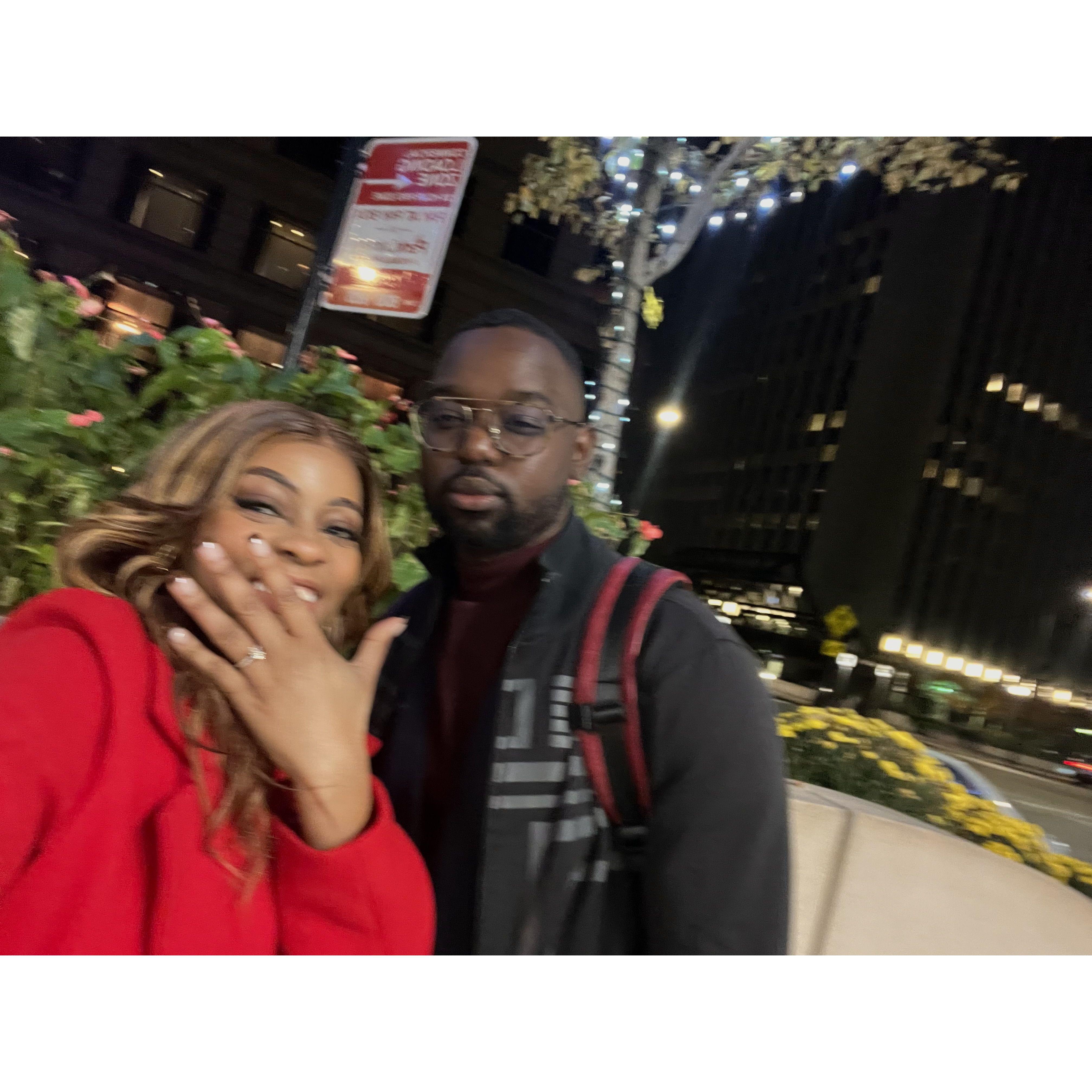 Danielle flashes a smile and her new ring moments after the proposal.