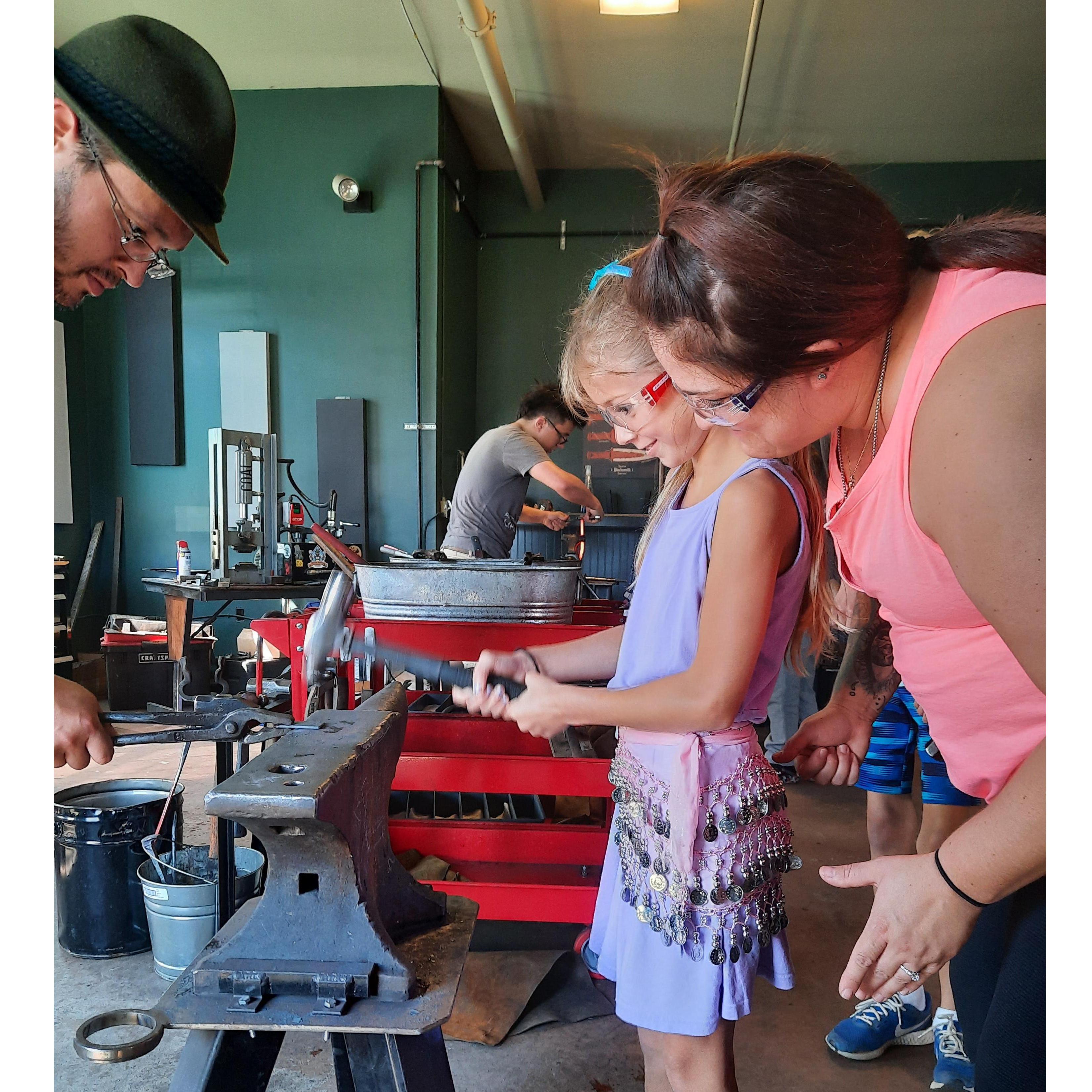 I told her to pretend she was hammering Wesley. Got a small smile out of her. Forging her rune keychain - Frankemuth, September 5, 2021
